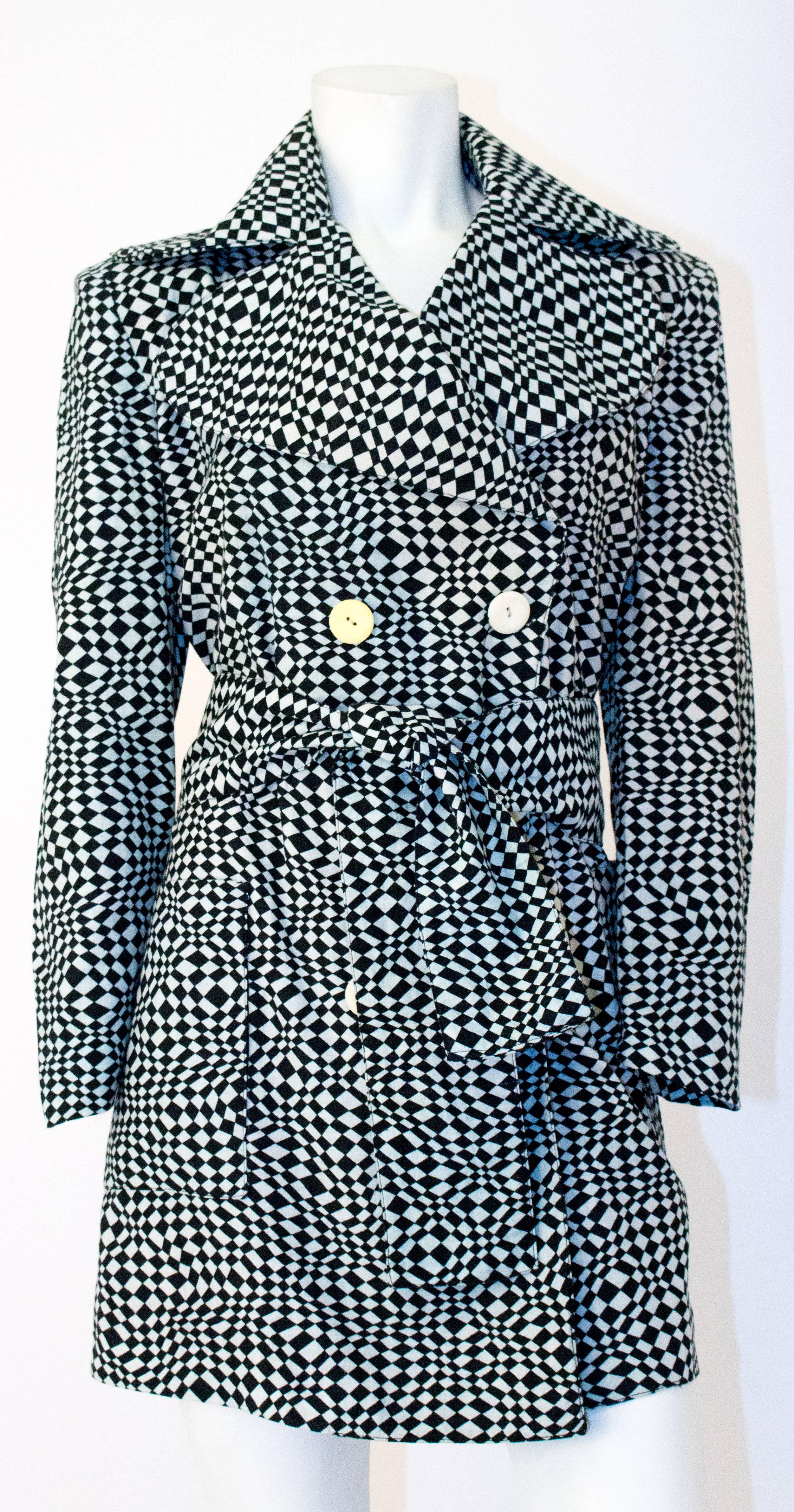60s Cotton Black & White OP ART Double Breasted Jacket. Mock double breasted. Front patch pockets. Original waist sash. Fully lined. 