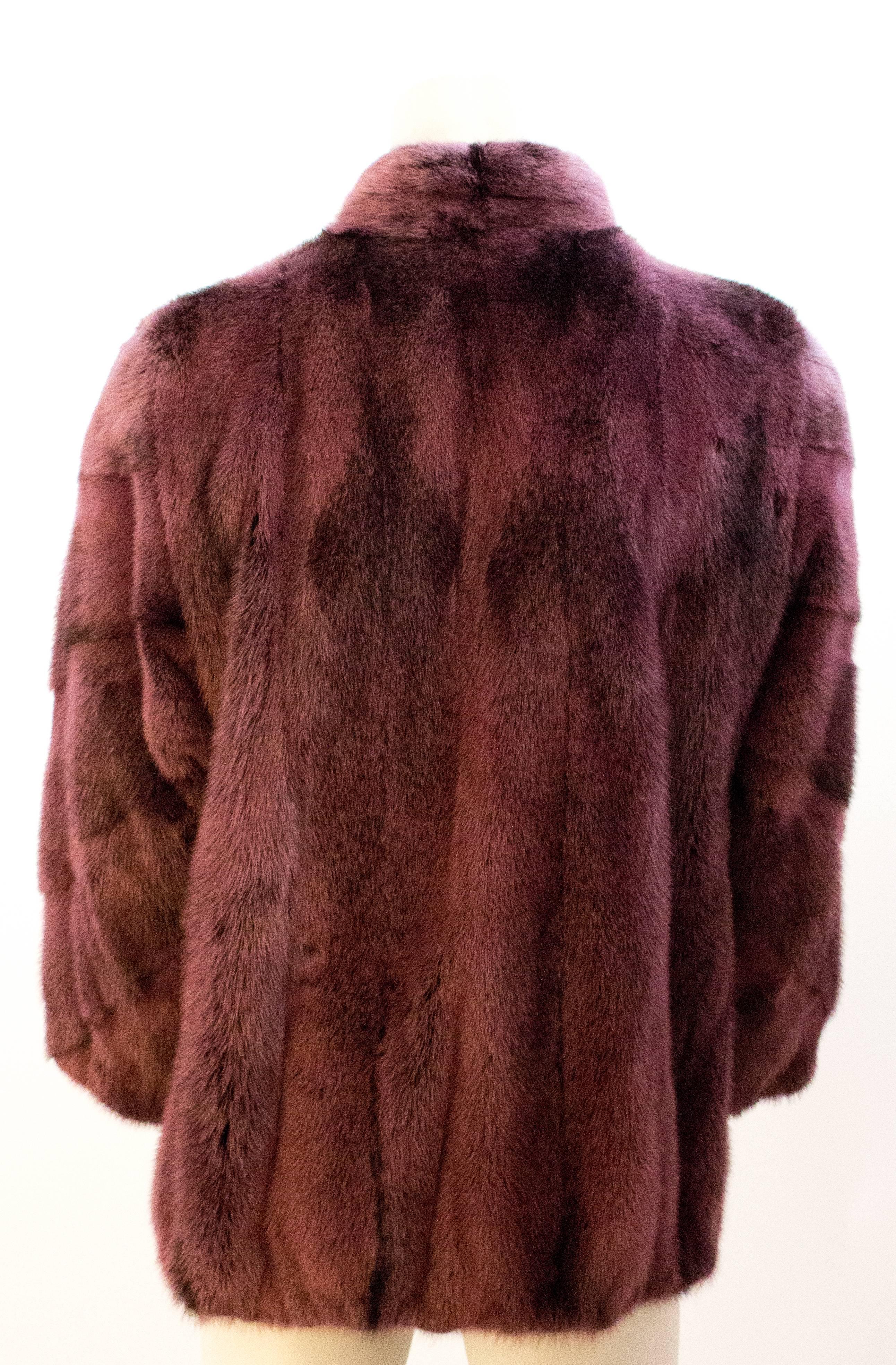 Purple Mink Bomber Fur Jacket with stand up collar. Zips up the front with leather trimmed black zipper. Fully lined

*Sleeve measurement: 24 inches
*Neck measurement: 18 inches 


