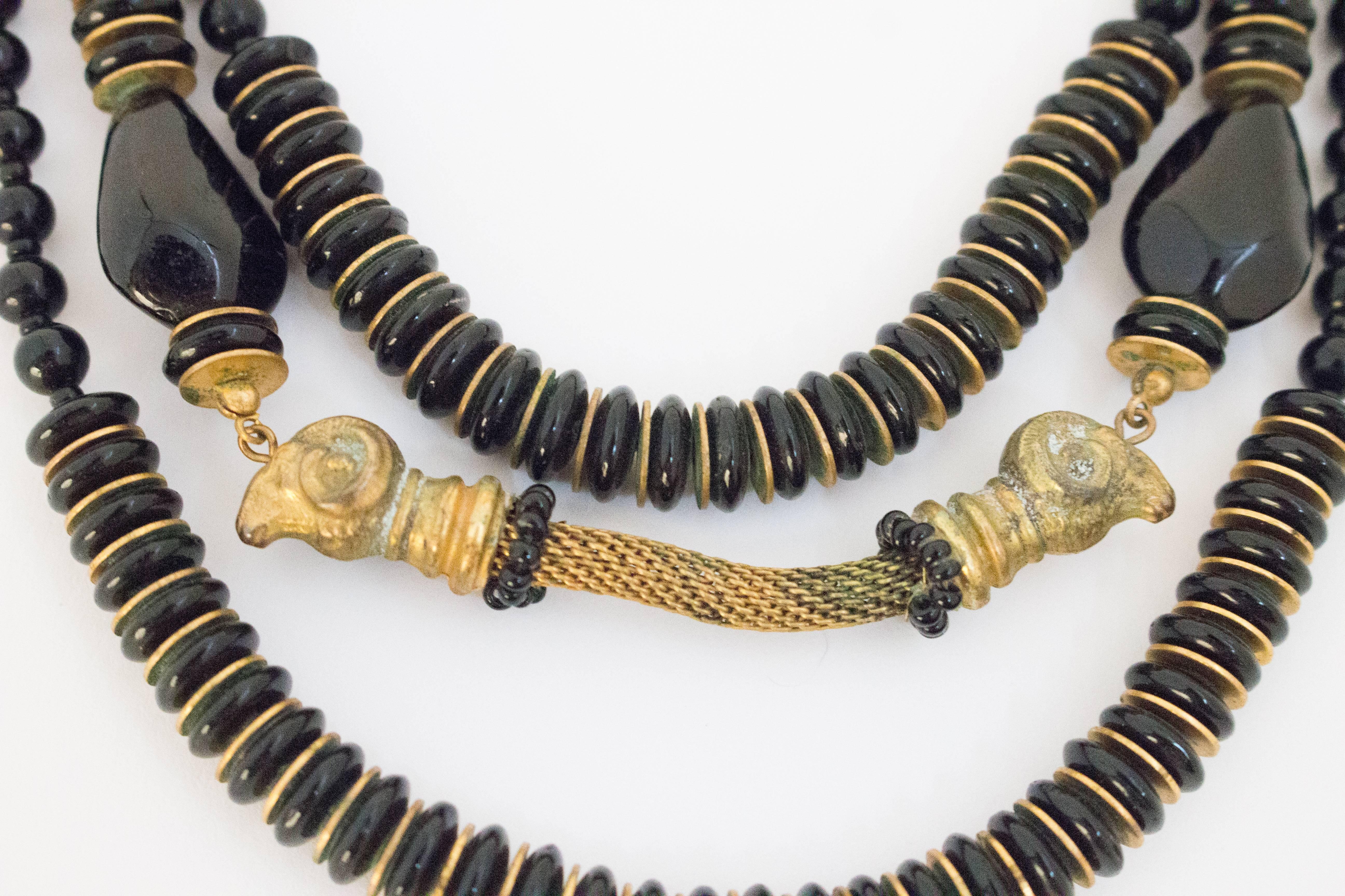 50s Miriam Haskell Black & Gold Ram Head Necklace. Original stamped clasp with wire beaded flower adornment. 

