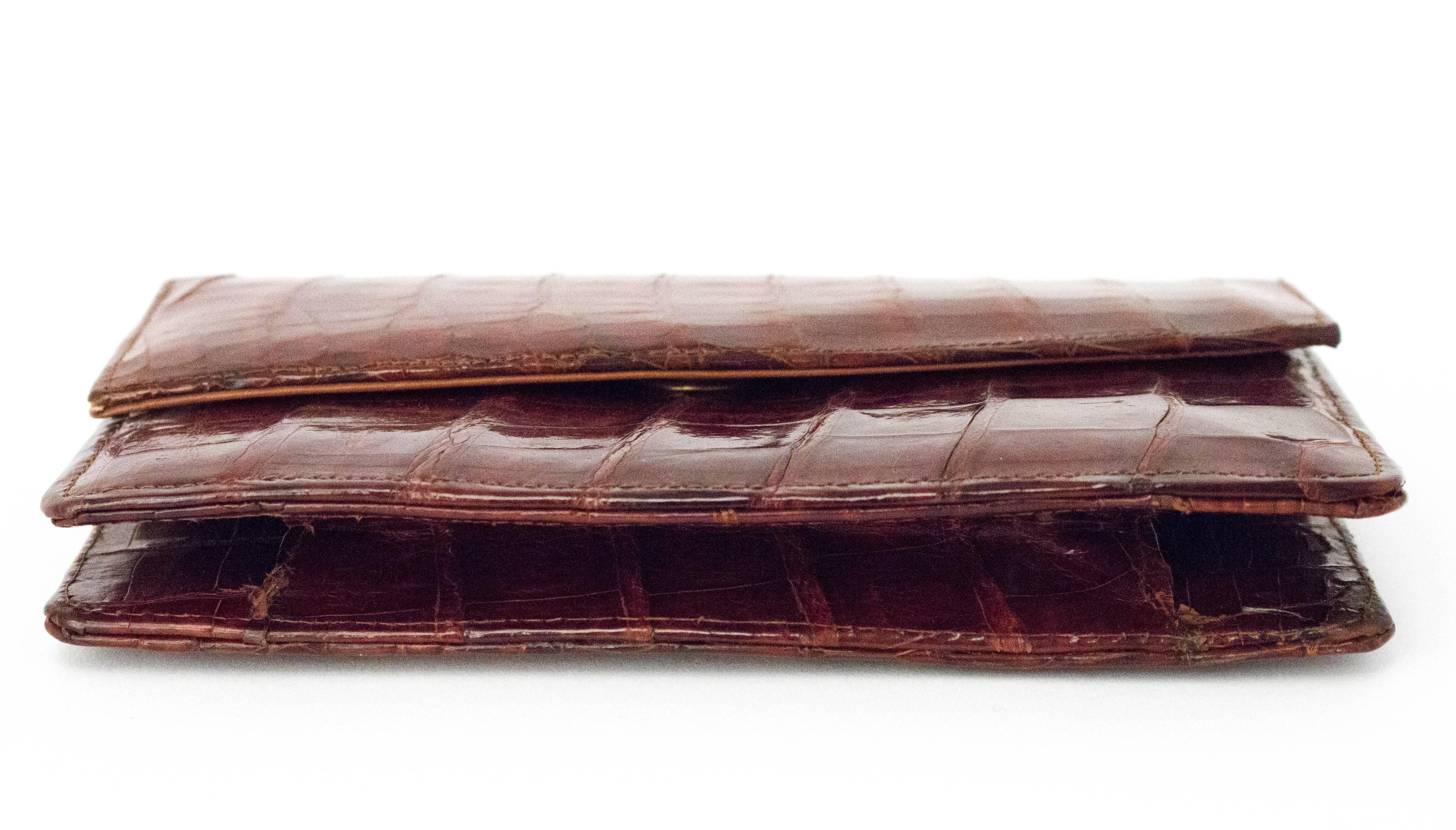 70s Brown Crocodile Wallet. Snap closure. One interior pocket. Sold in As-Is condition. 