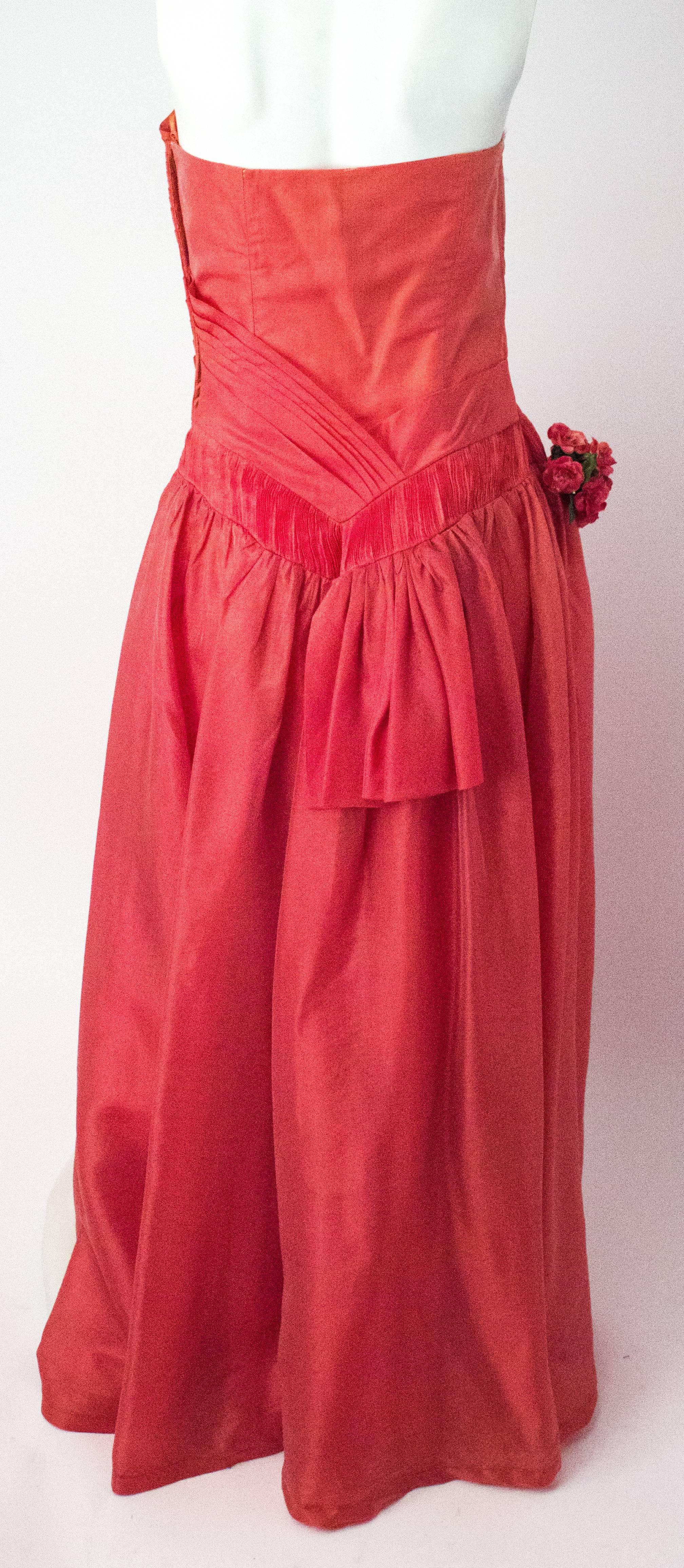 1950s iridescent coral organza gown. Drop waist with floral bouquet detail. 