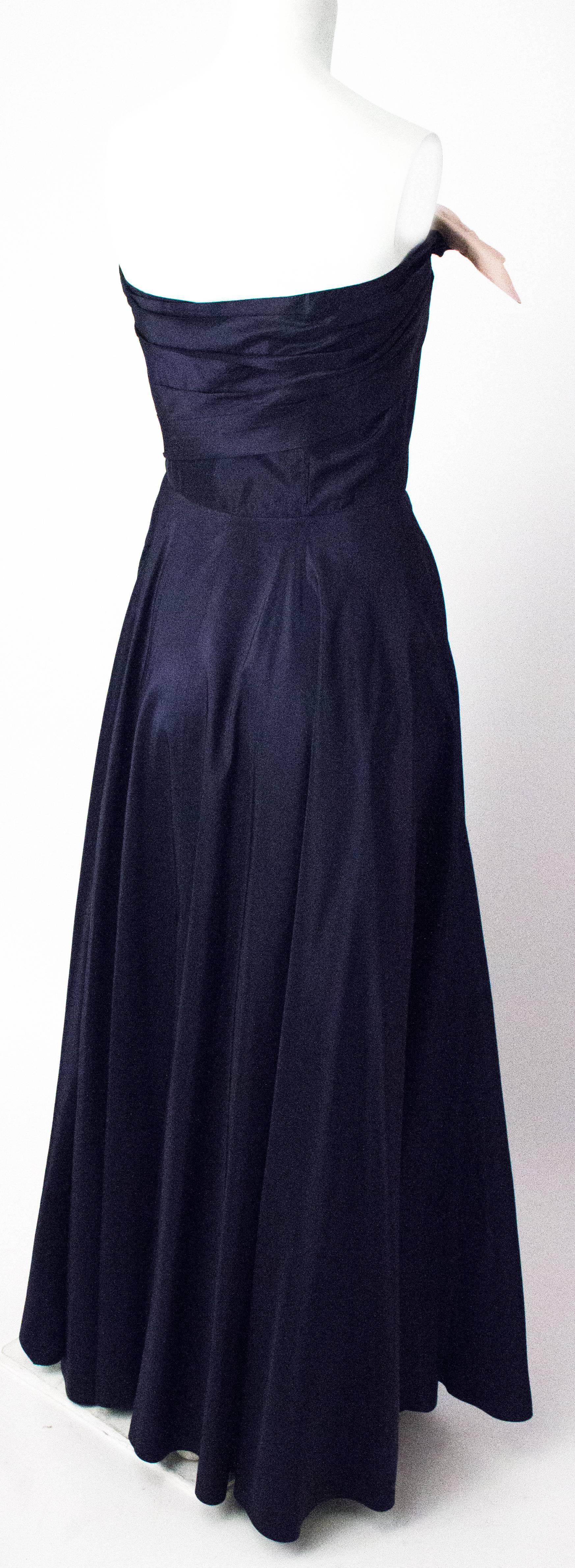 50s Navy Taffeta Strapless Gown with Pink Satin Hip & Bust Bow. Metal zipper. 