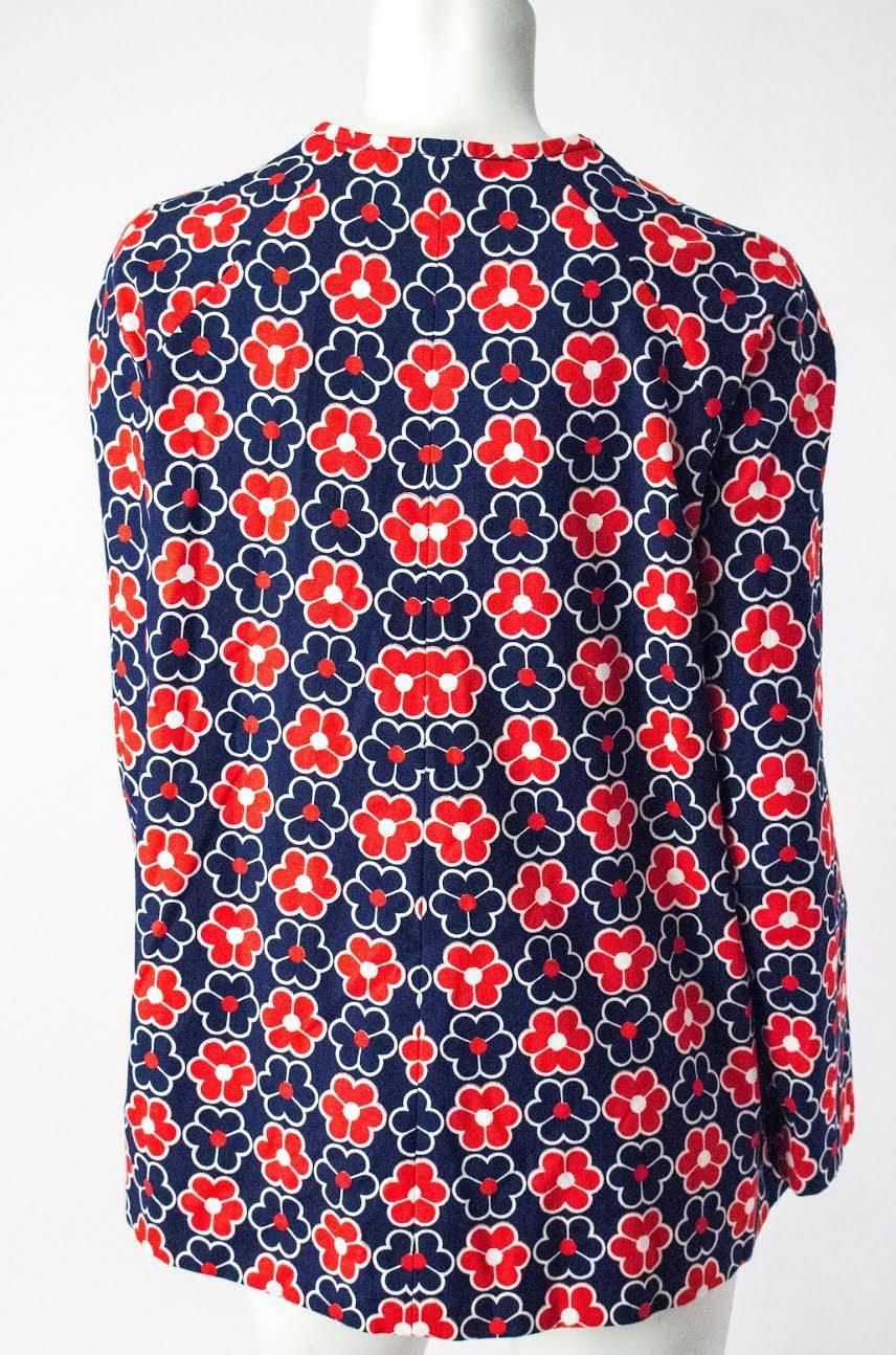 1960s red white and blue flower power printed mod jacket. No closures. 22 1/2