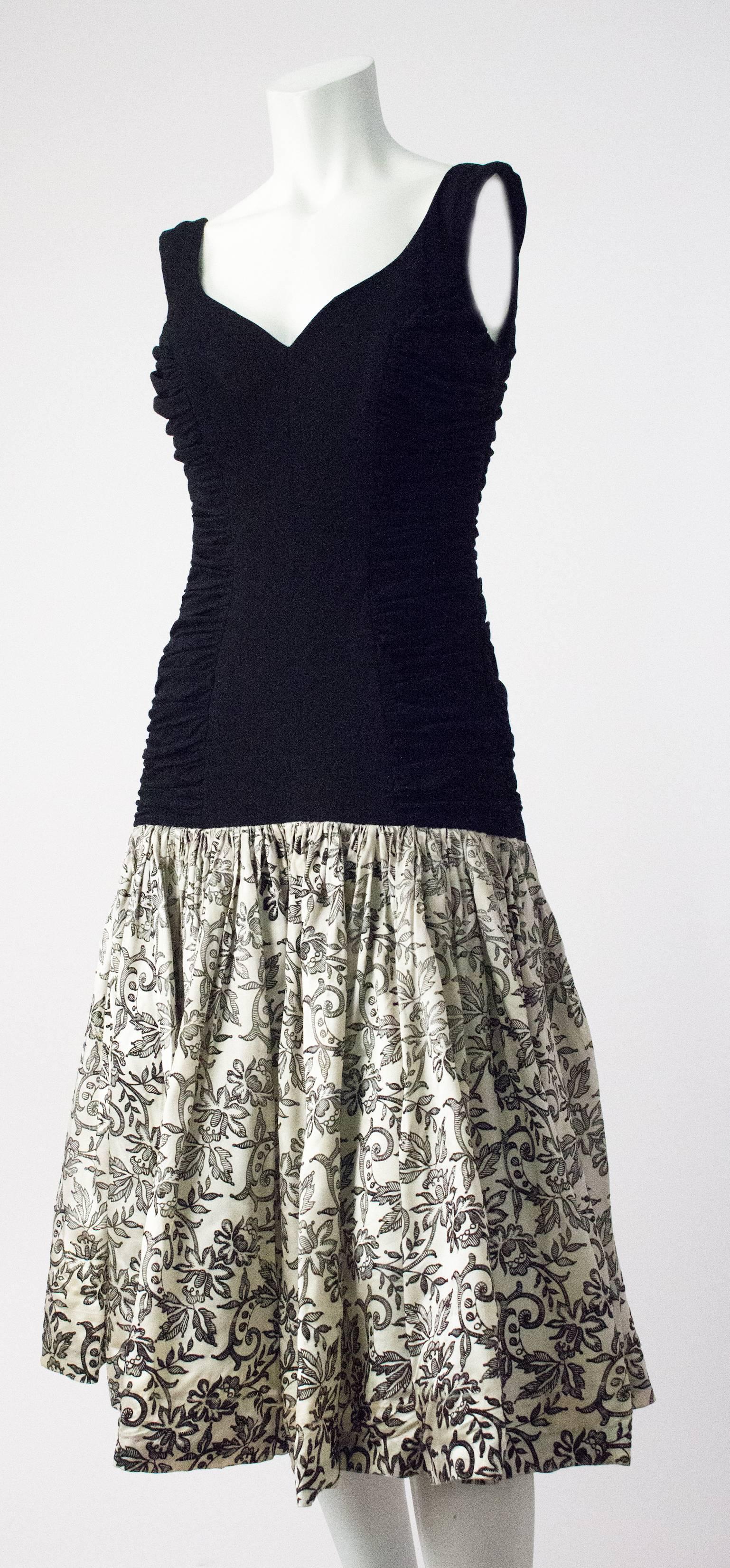 50s flocked Velvet Drop Waist Cocktail Dress. There is a lot of fading and wear on the velvet of the skirt, as well as badly done repairs to the shoulder and armhole area. That being said, the fit and style of this dress is amazing! It would be