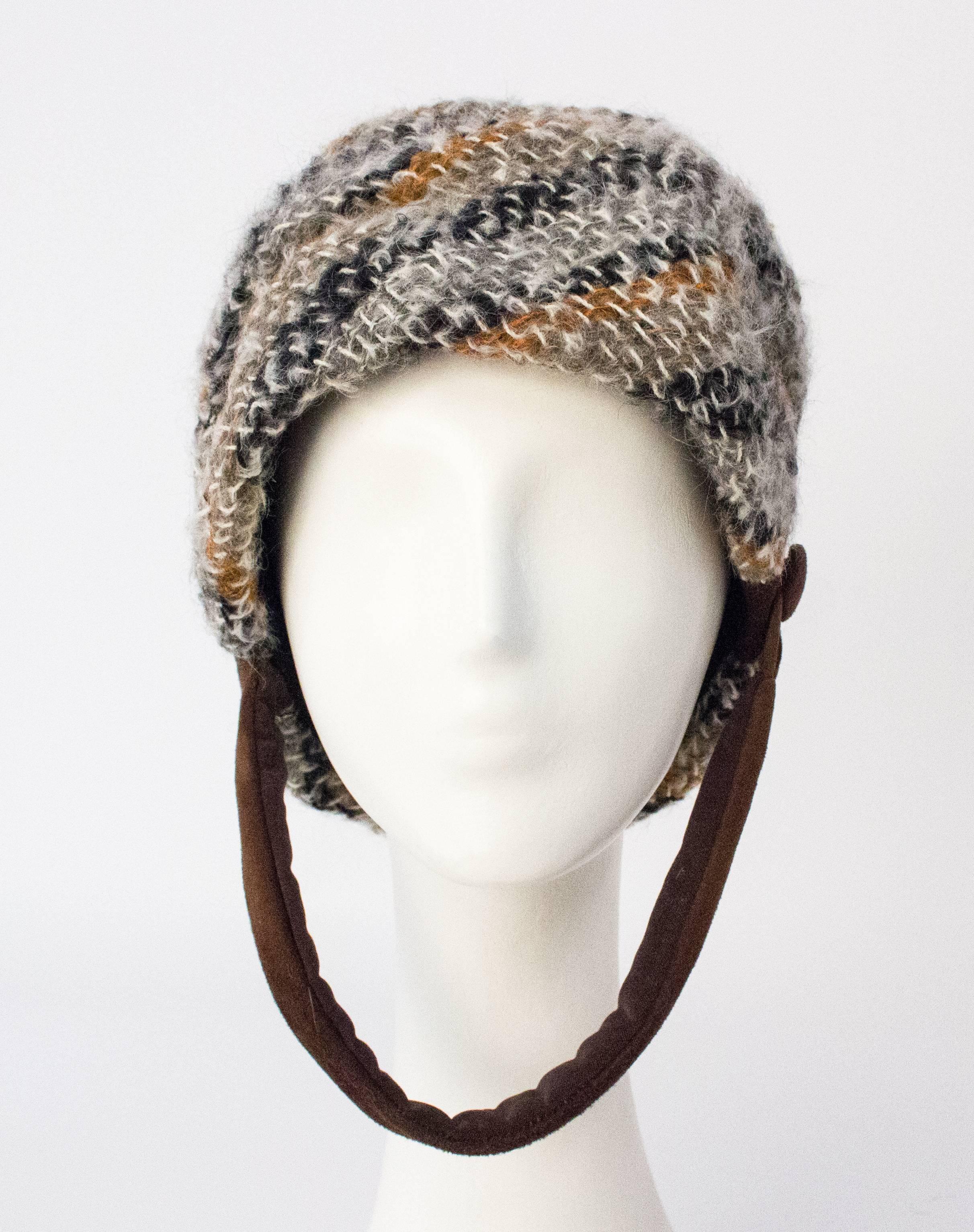 60s Christian Dior Knit Helmet

21 1/4" circumference
8 1/2" height (not including chinstrap)