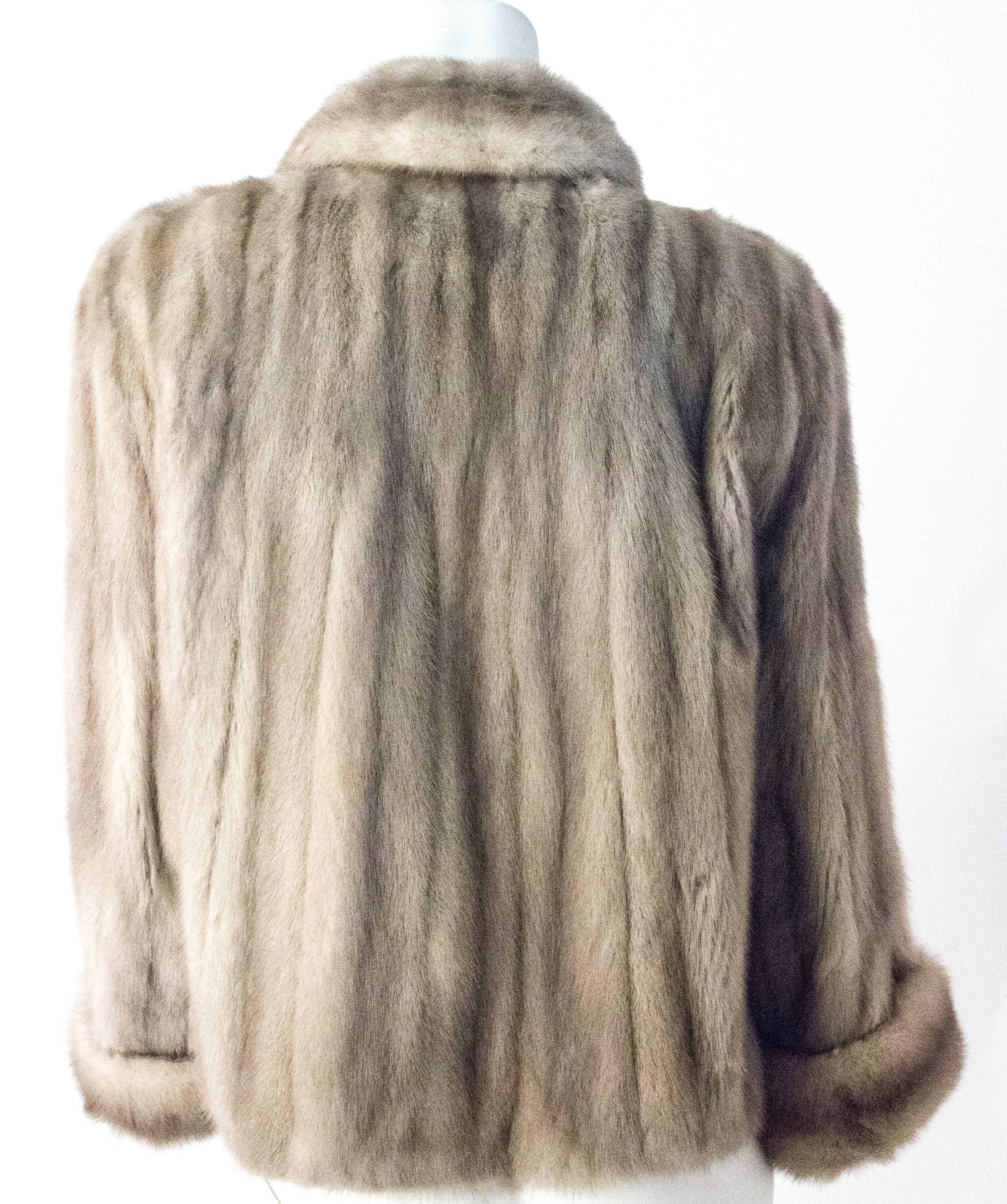 60s Grey Mink Jacket with Cuffed Sleeves. Sleeve is full length with about 8 inches of fold in the cuff for custom length adjustment. Fully lined. Approximately size Small/Medium. 