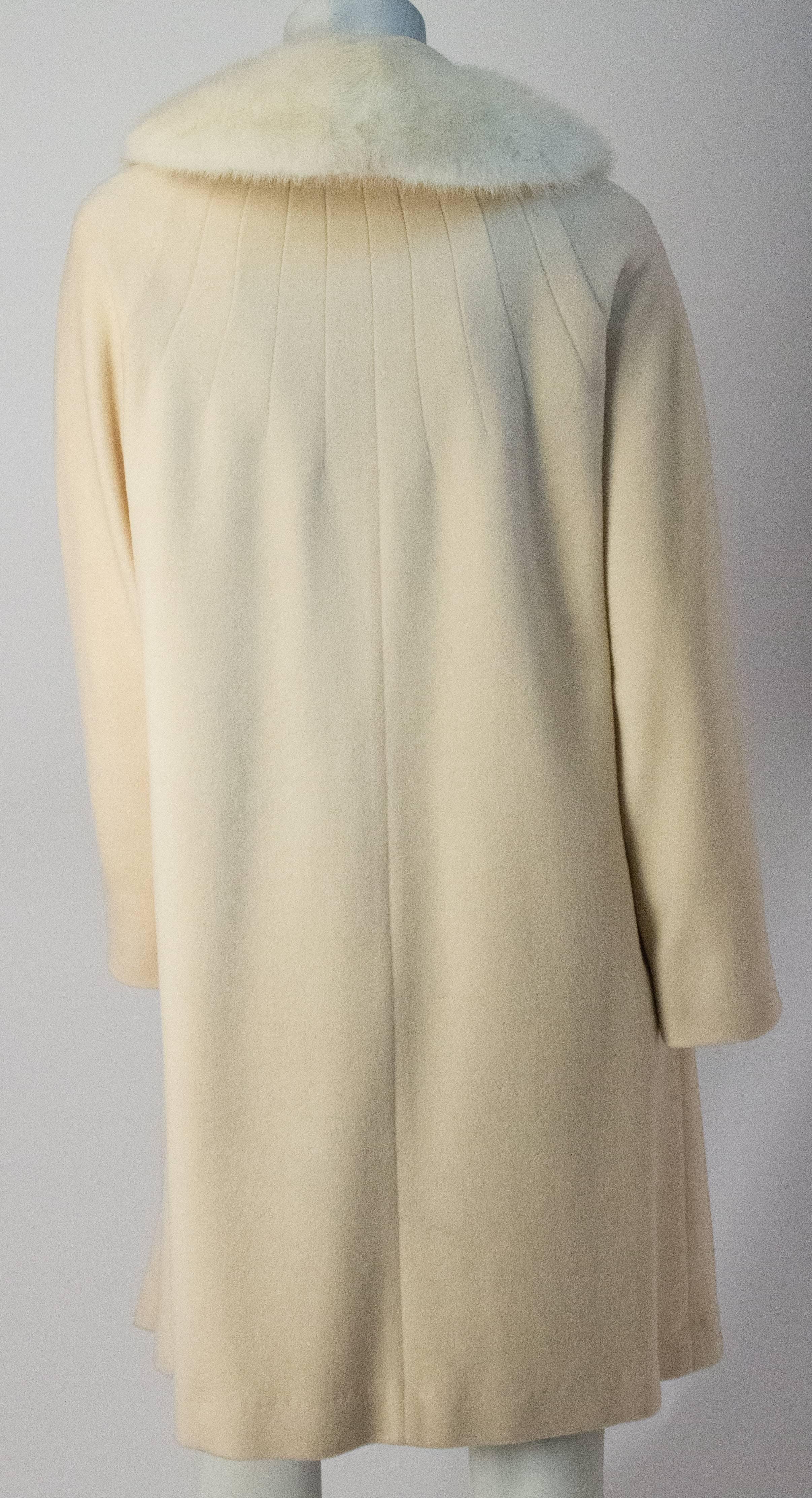 60s Cream Cashmere Coat with Mink Collar. Silk lining. Fits anywhere approximately between US size 4-8. 