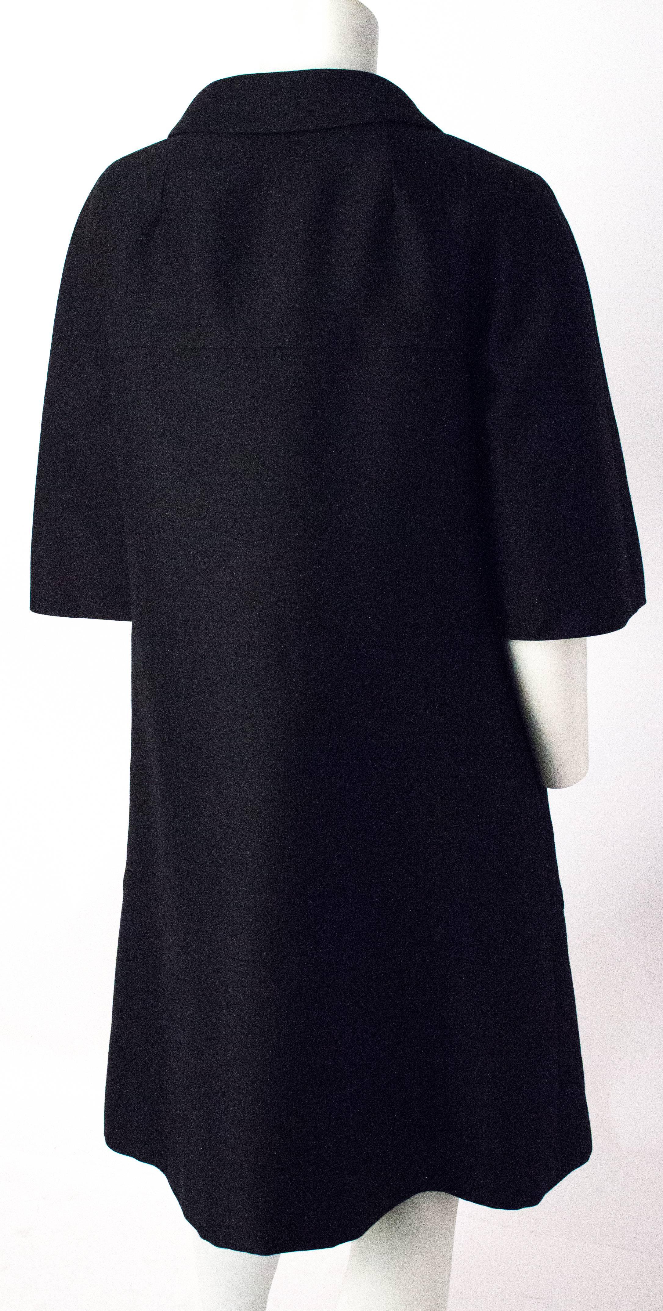 50s Saks Fifth Ave Black Silk Trapeze Coat. Glove length sleeves. Approximately  US size small to medium. 