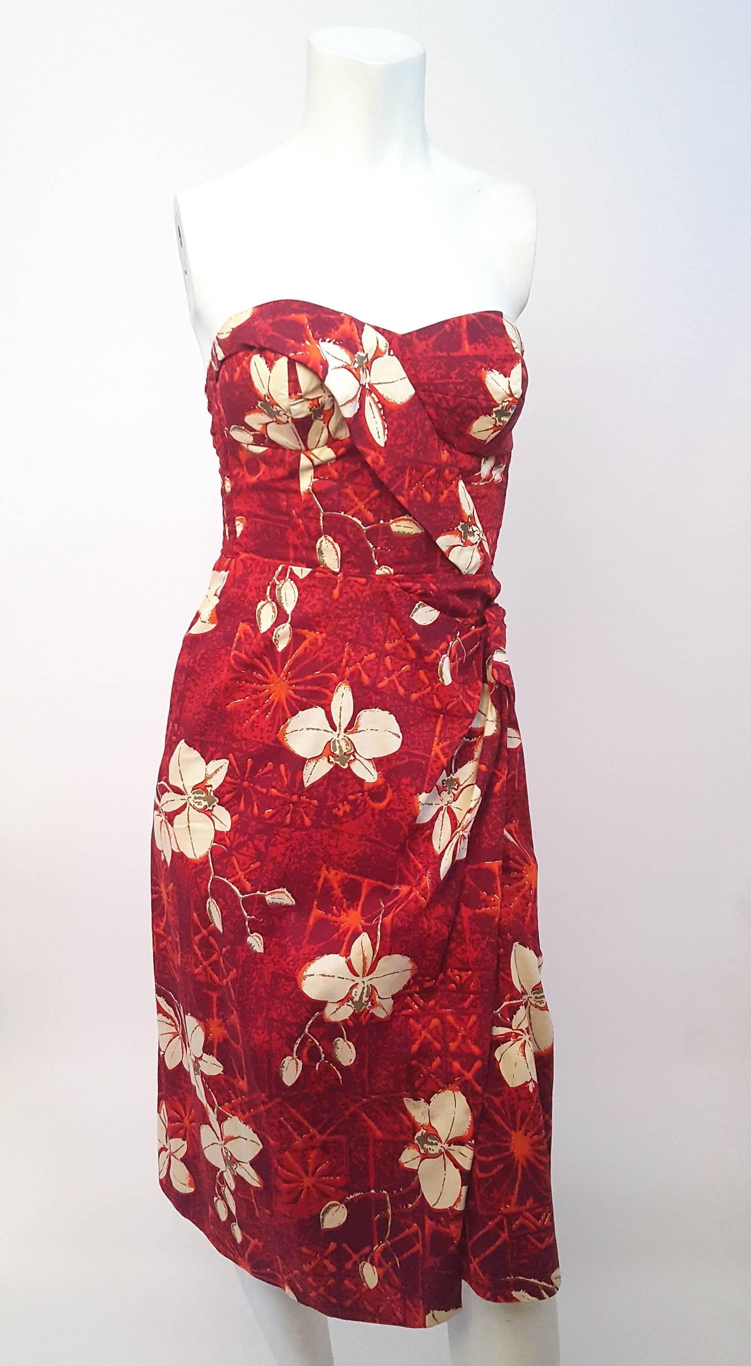 50s Alfred Shaheen Red Printed Cotton Tiki Dress. Convertible halter strap removes via buttons. Back panel shirring allows some stretch. Back zipper closure.