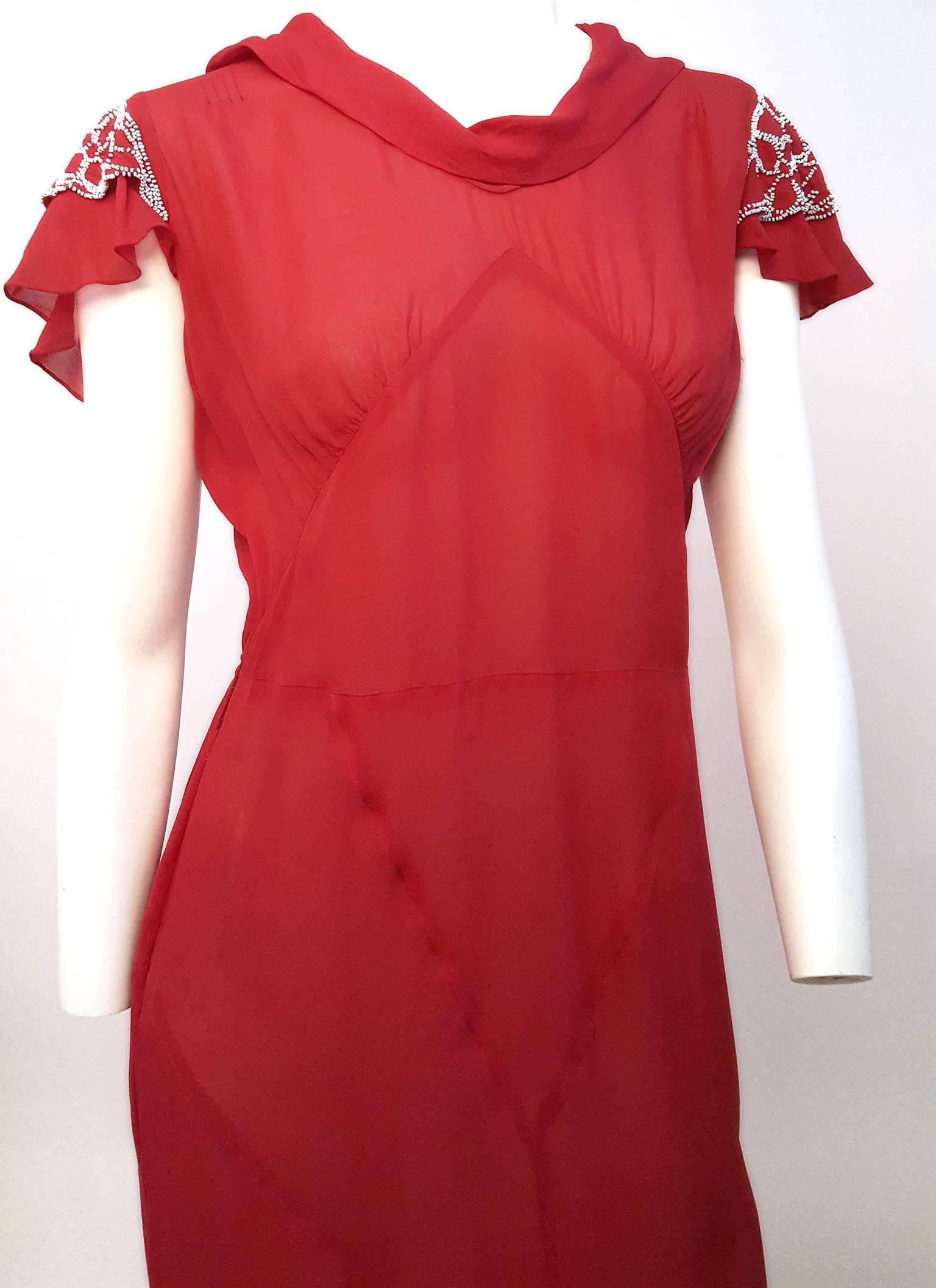 30s Red Chiffon Day Dress w/ Seed Bead Embellishment. Comes with detachable sash. Metal snap side closure. Wear on fabric consistent with age.