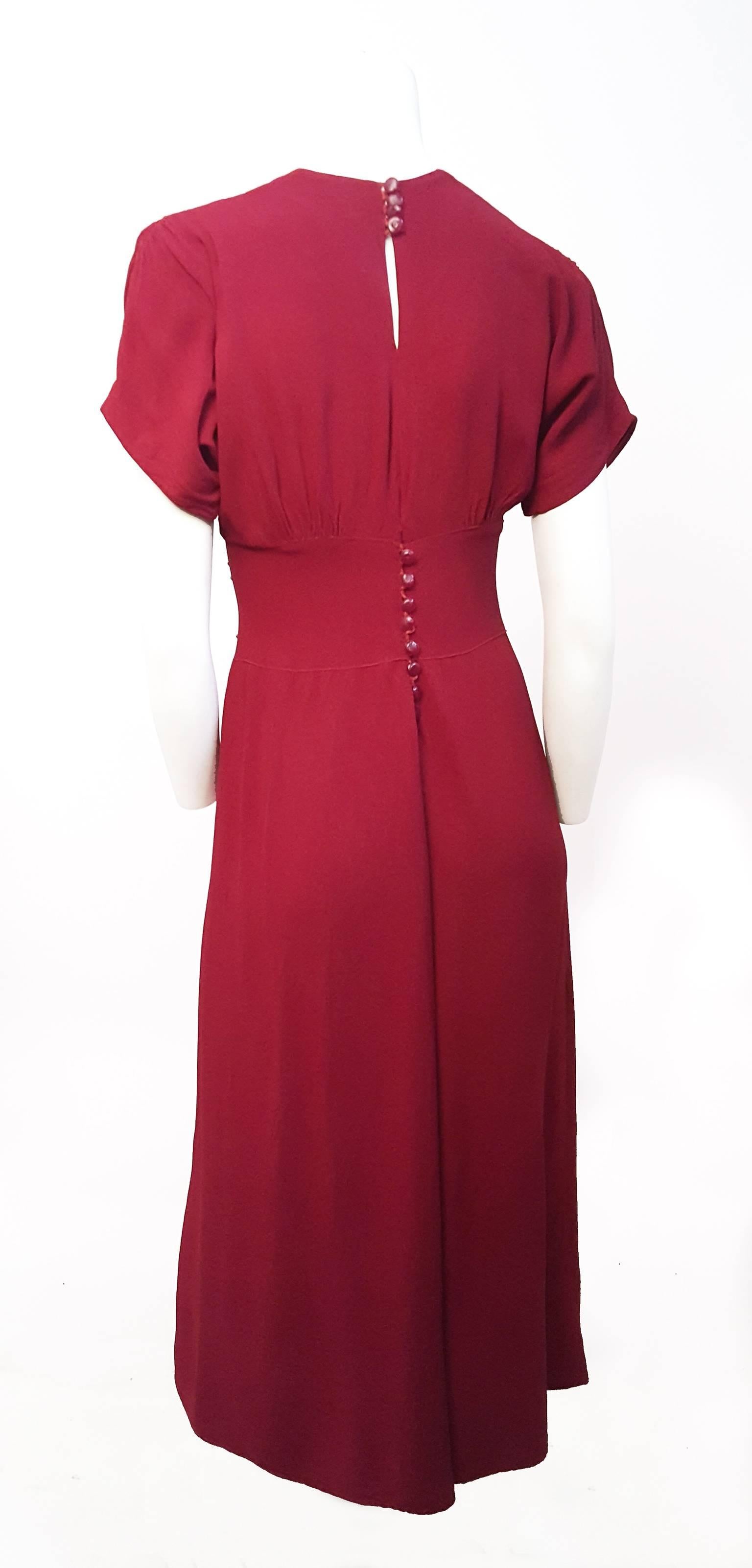30s/40s Red Knit Jersey Dress w/ Bead Detail. Smocking detail on bodice and sleeves. Back button closure.