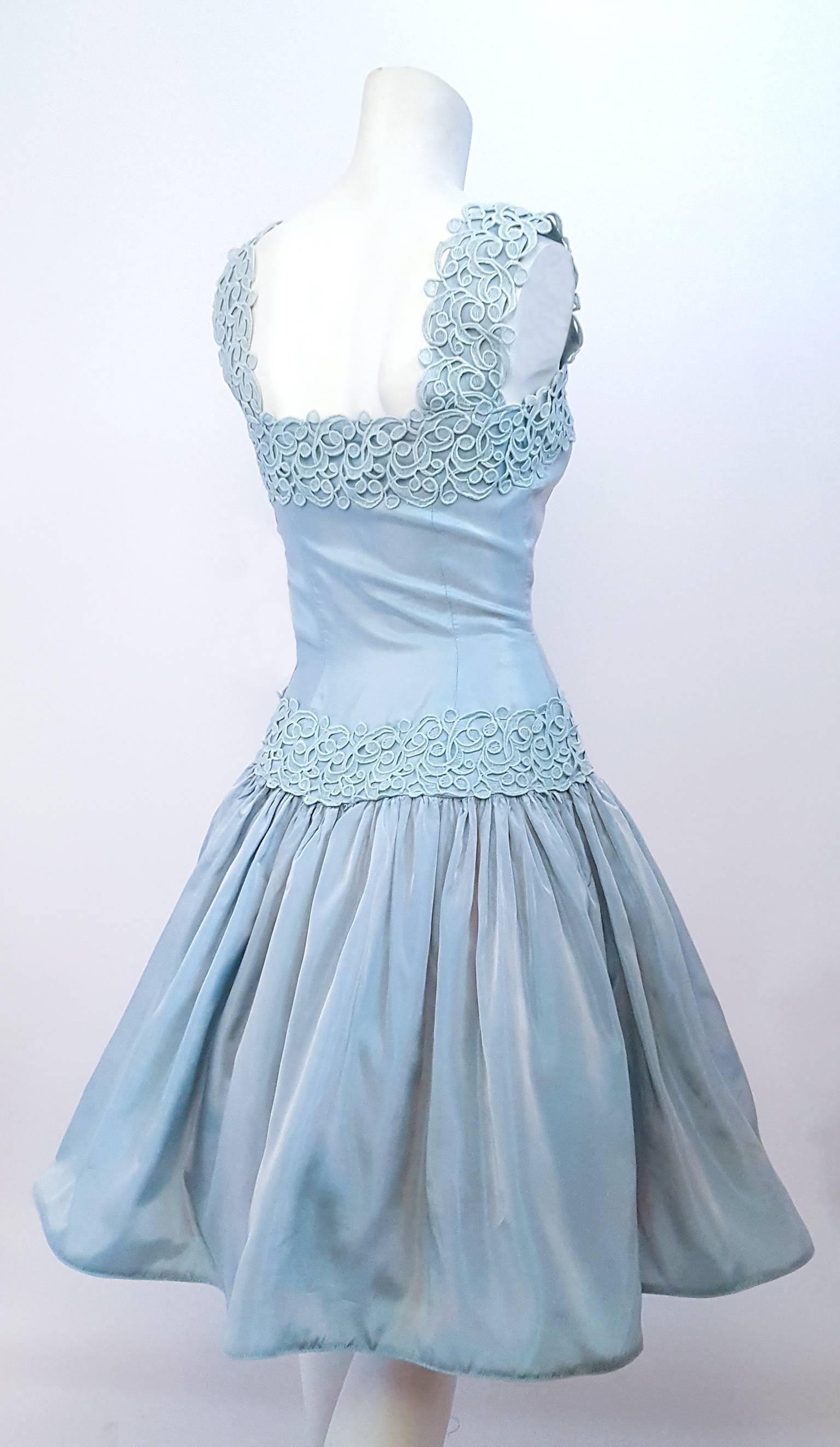 60s Iridescent Baby Blue Party Dress. Lined bodice, skirt is lined with tulle and has horsehair hem. Metal side zip. Please note that dress is styled with petticoat.