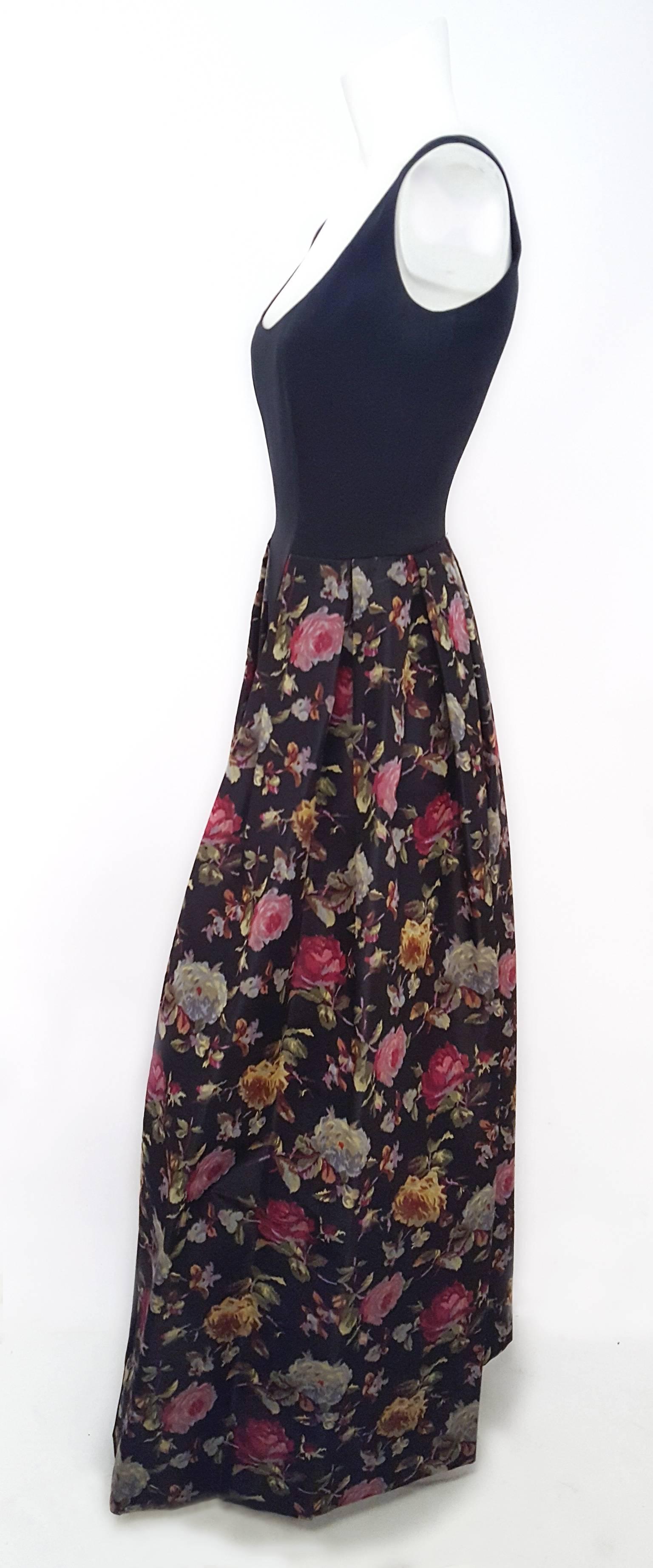 80s Black Abstract Floral Dress. Bodice is a jersey fabric, lined in silk satin. Peplum is printed taffeta lined in organza. Back zip closure.