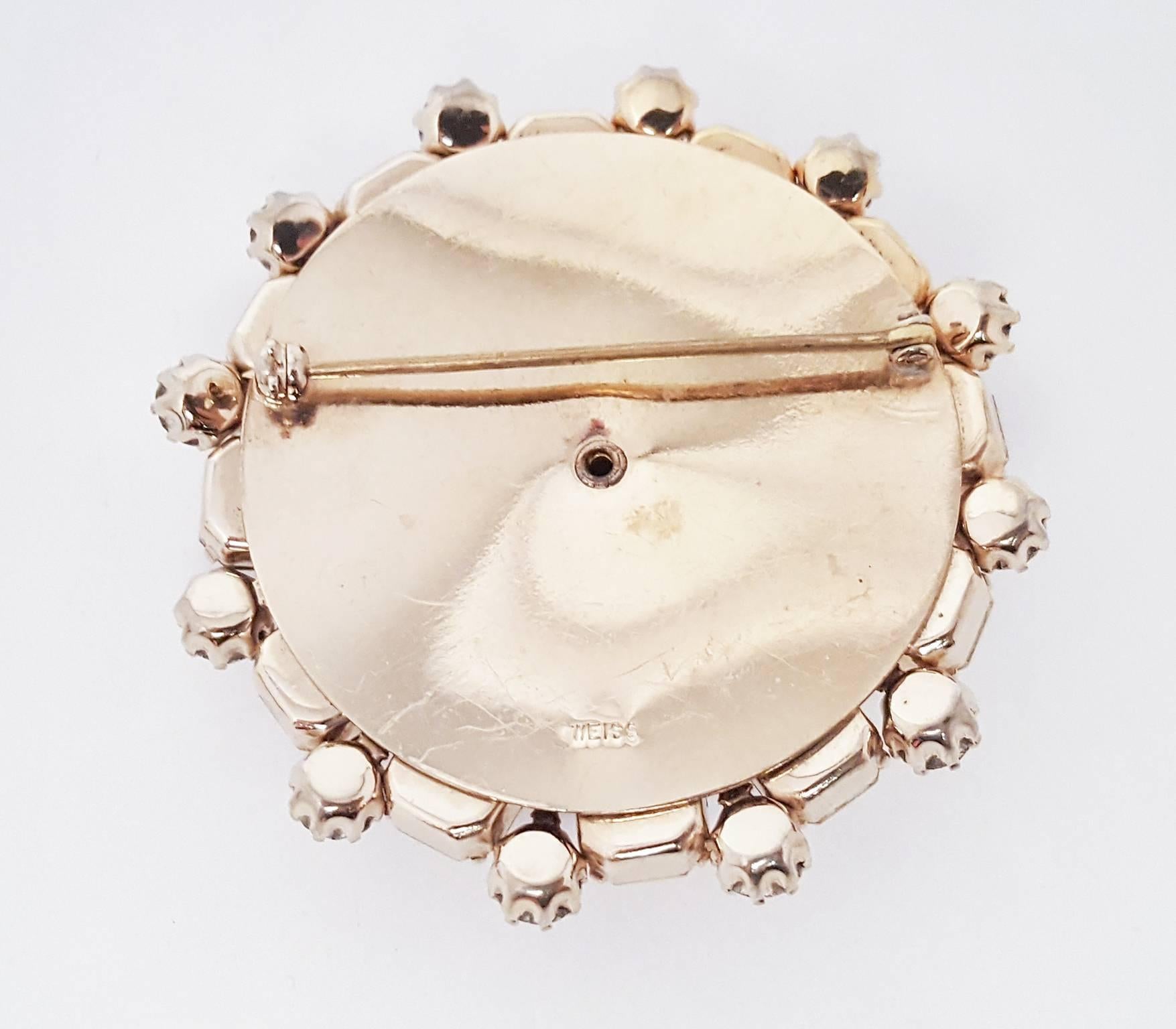 1950s Aurora Borealis Crystal Weiss Brooch and Earrings Set. Signed brooch. Clip-on earrings.

Brooch: 2 1/4