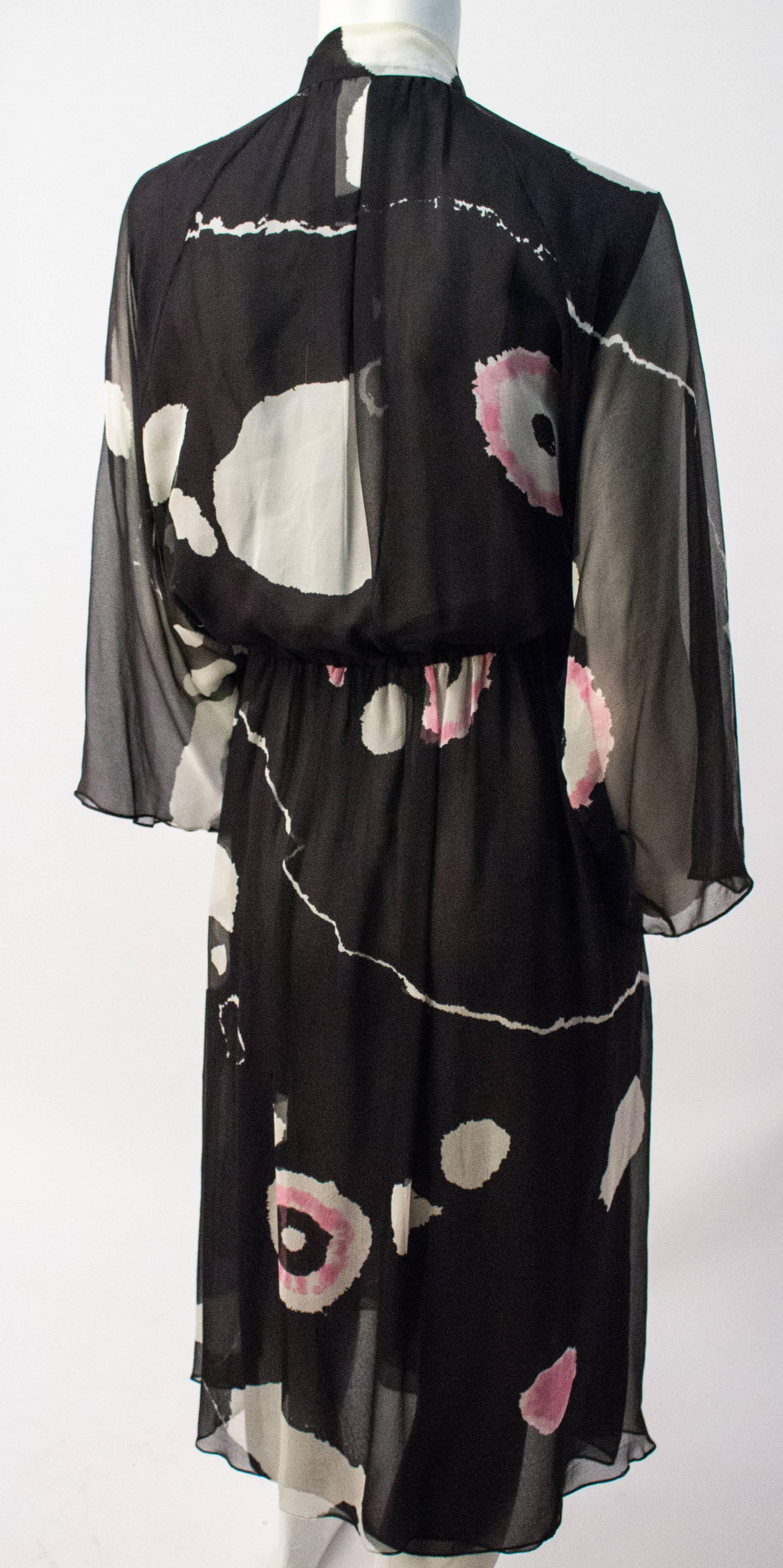 70s Hanae Mori Printed Silk Chiffon Dress. Front snap closure. Elasticated waist.  Rayon lining. 

28