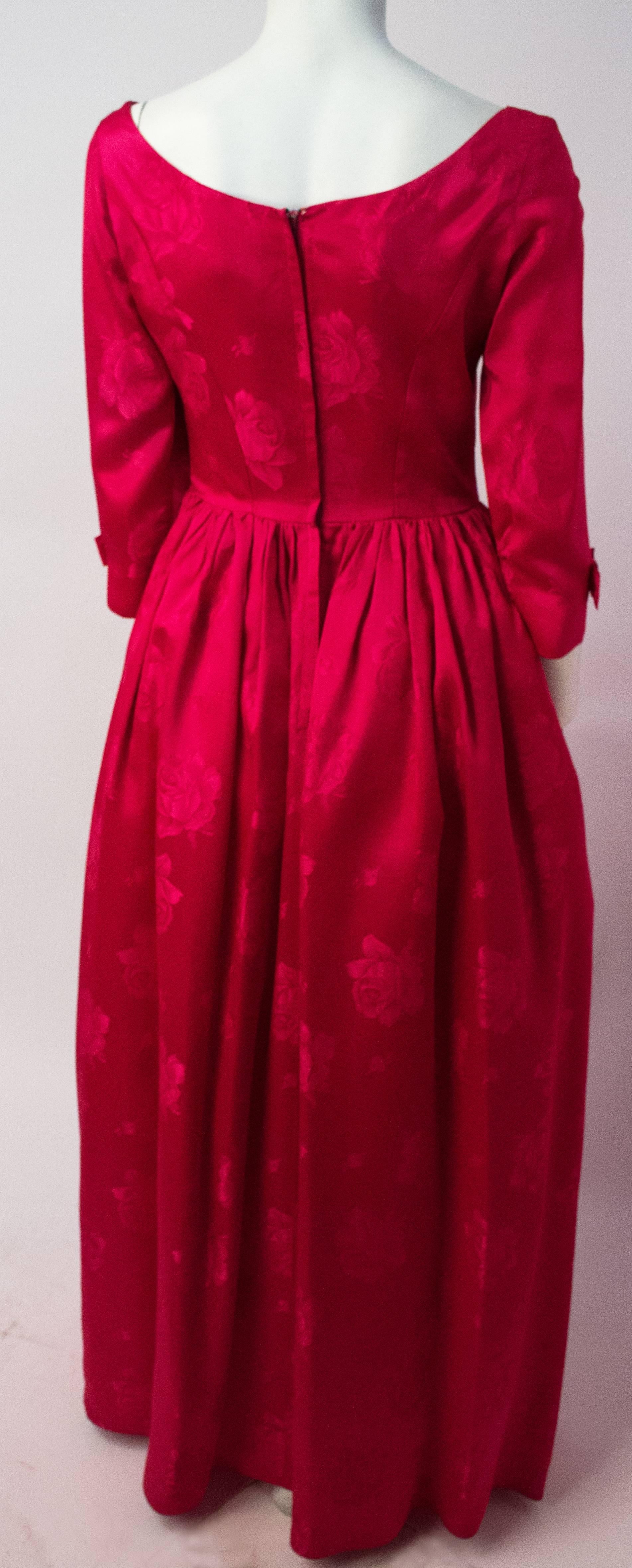 50s Magenta Rose Jacquard Gown. Metal back zip. Skirt lined in tulle. 