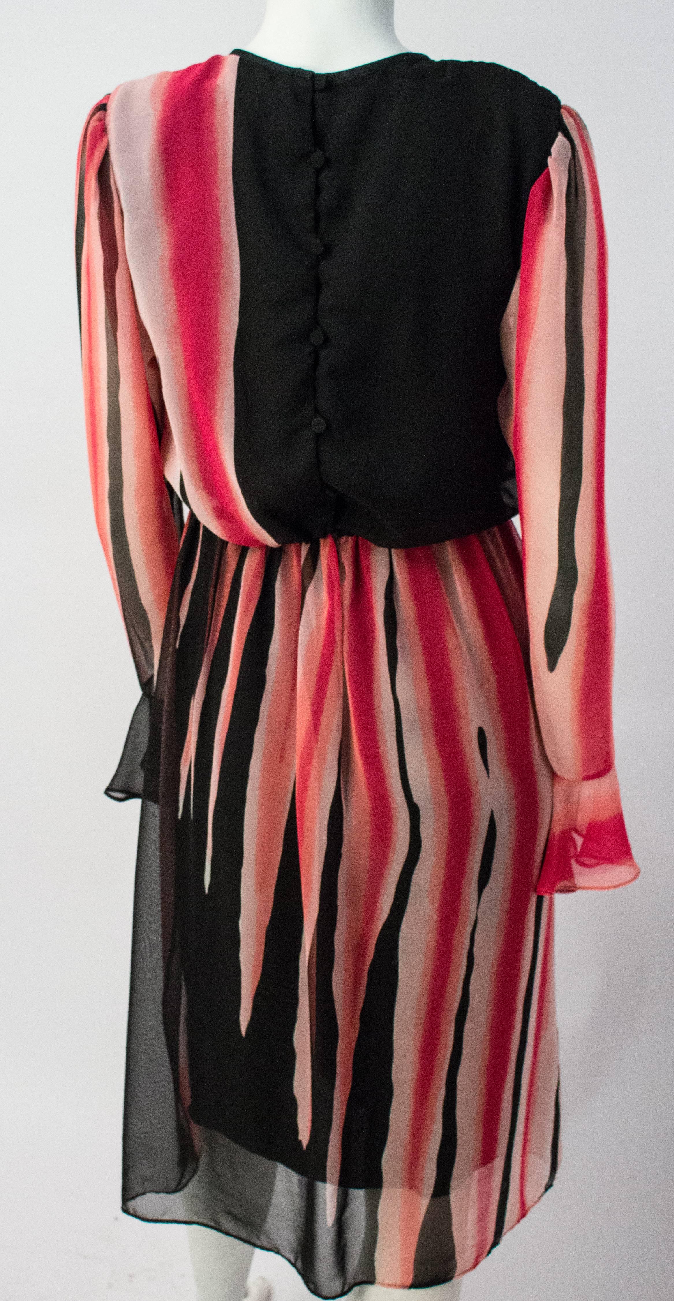 80s Hanae Mori Printed Silk Chiffon Magenta and Black Dress. Lined bodice and skirt. Back button closure. Elasticated waist, 26