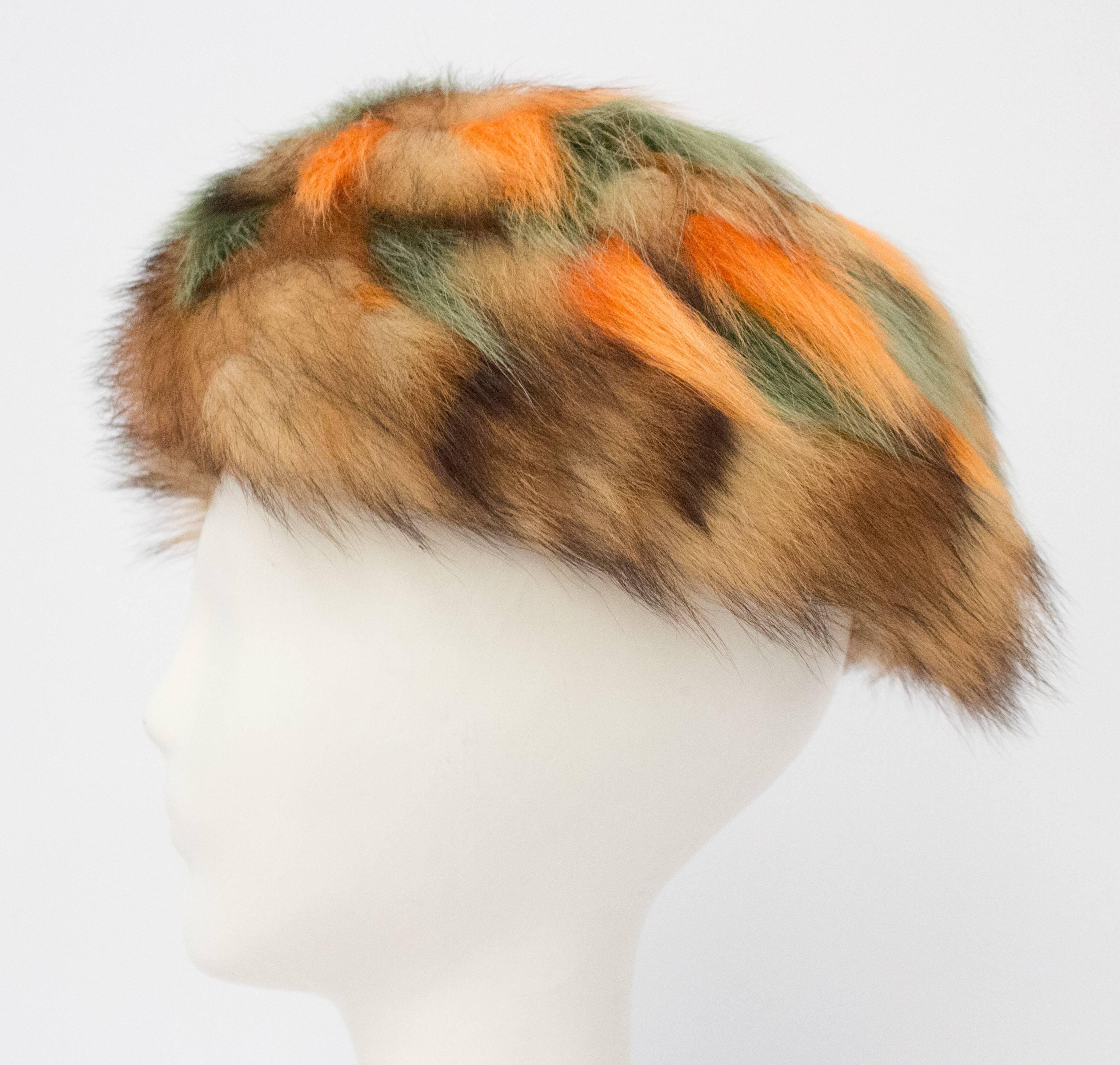 60s Multicolor Orange and Green Raccoon Fur Hat. Lined in lace, some discoloration on lining shown in photo. 

21