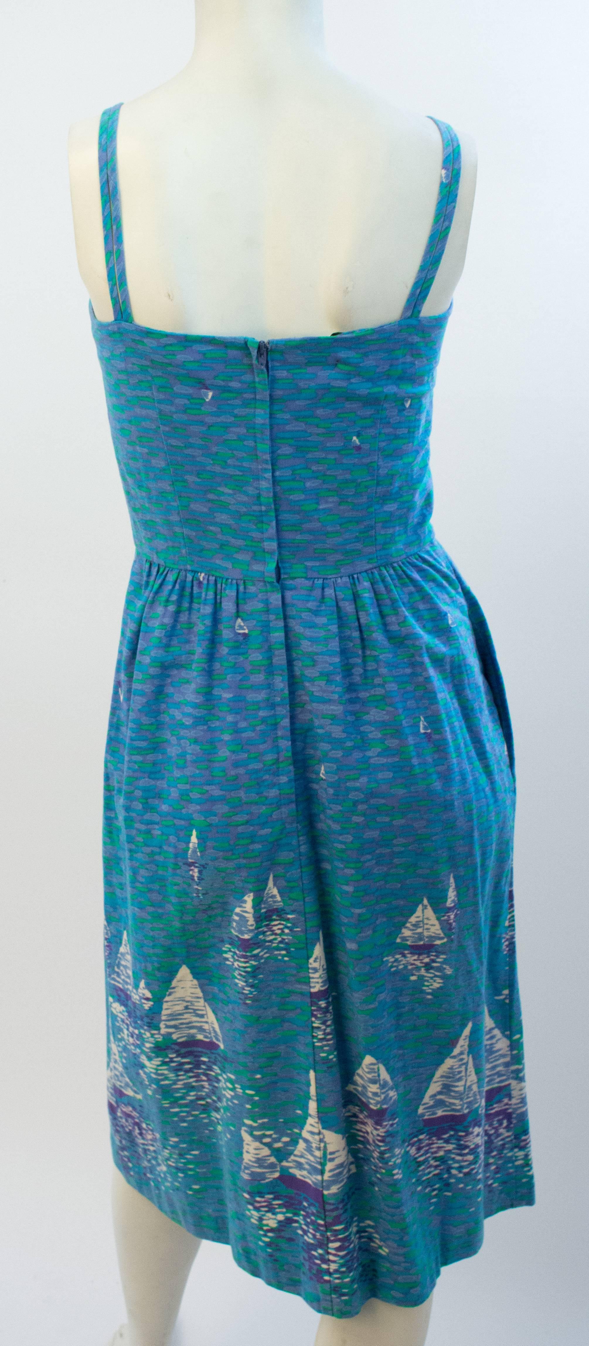 1970s Blue Printed Impressionist Sailboat Sundress. Cotton. Built-in bra. One side seam pocket. Back zip closure.