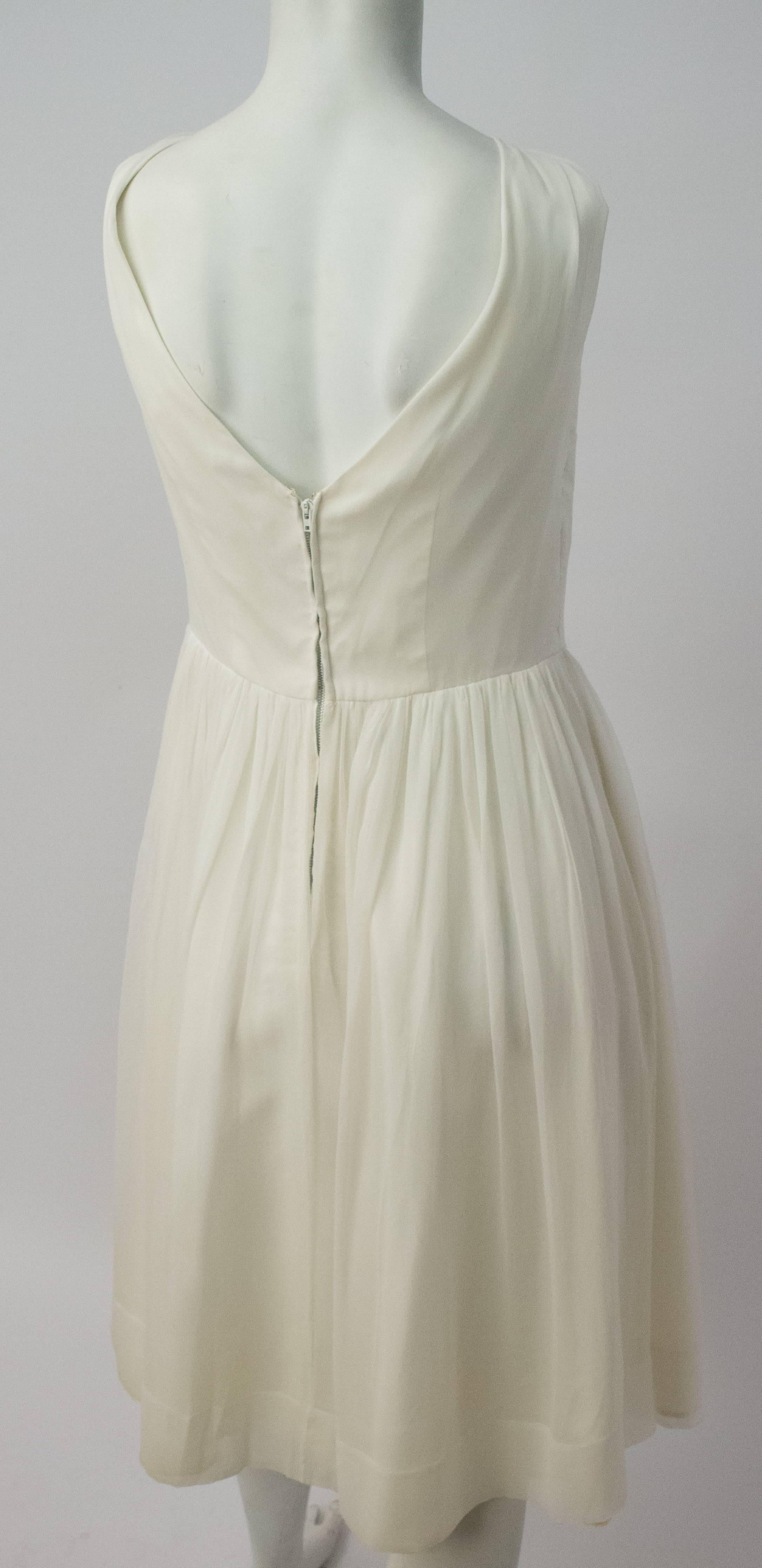 50s White Chiffon and Satin Party Dress. Fully lined. Metal back zip. Some discoloration on lining, not visible from outside.