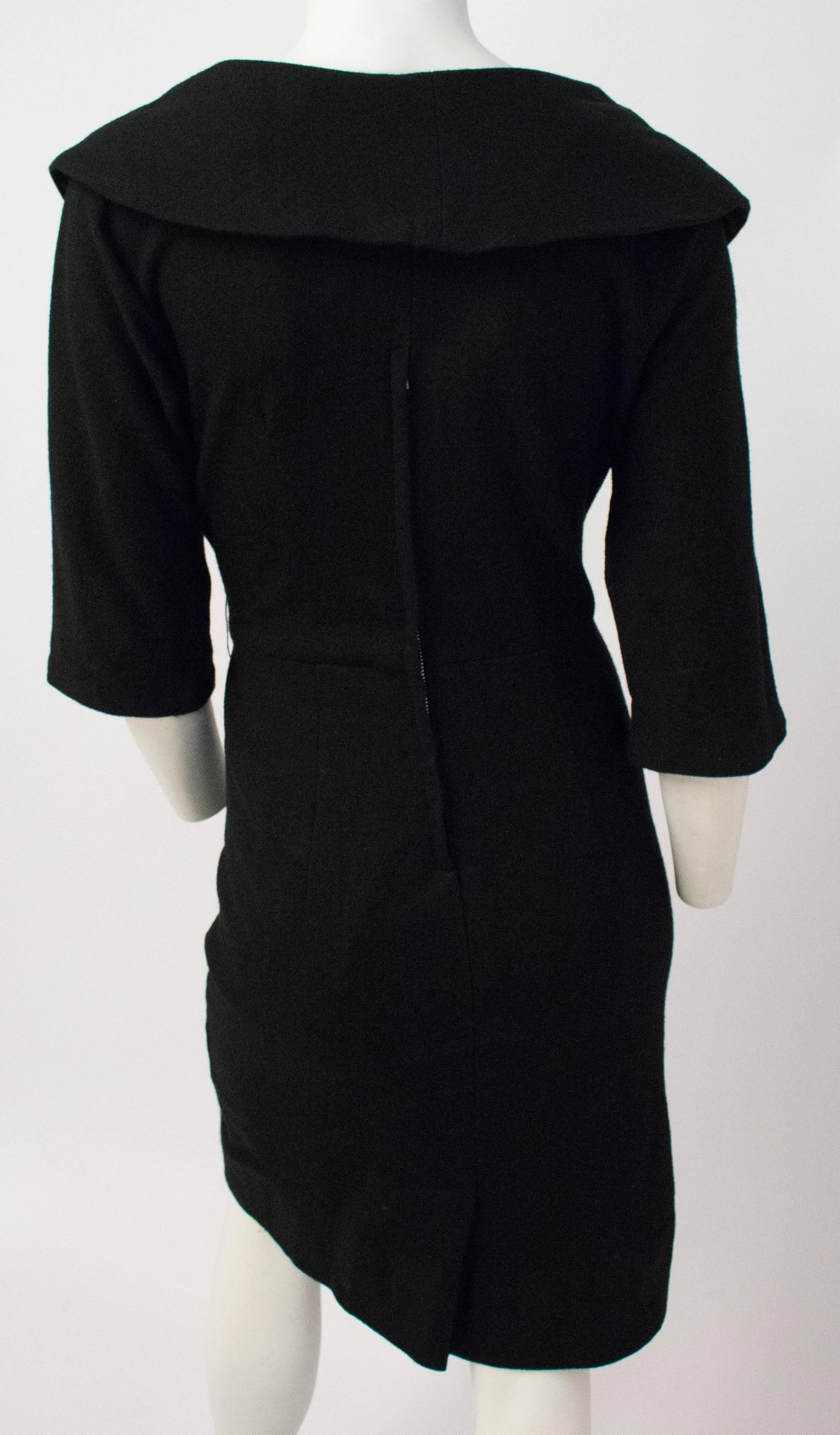 50s Black Wool Dress w/ Bow. Unlined, back metal zipper. Dolman sleeves.