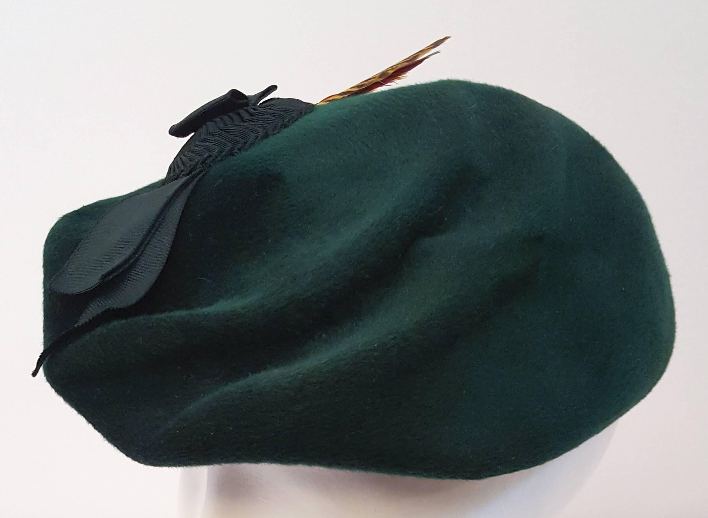 green felt hat with feather