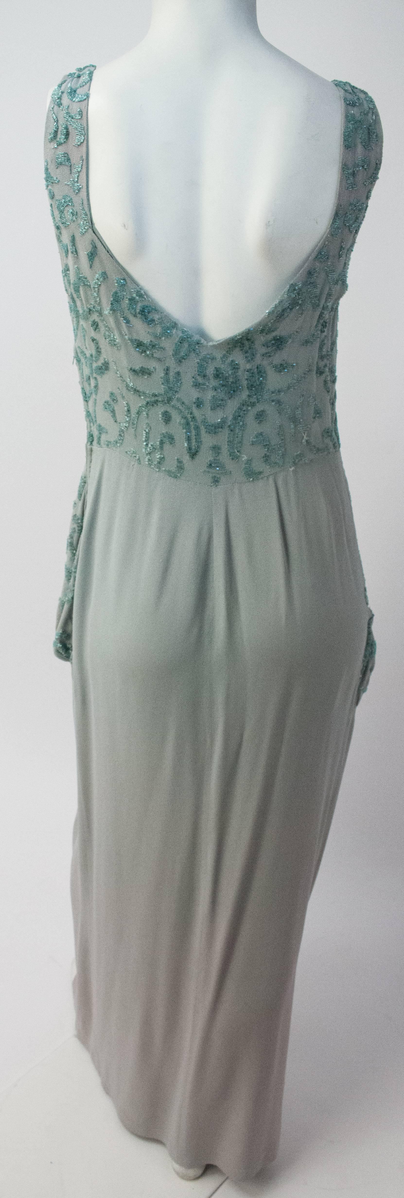 40s Beaded Peplum Evening Dress. Glass beads on heavy crepe. Side zip closure. Has pockets!