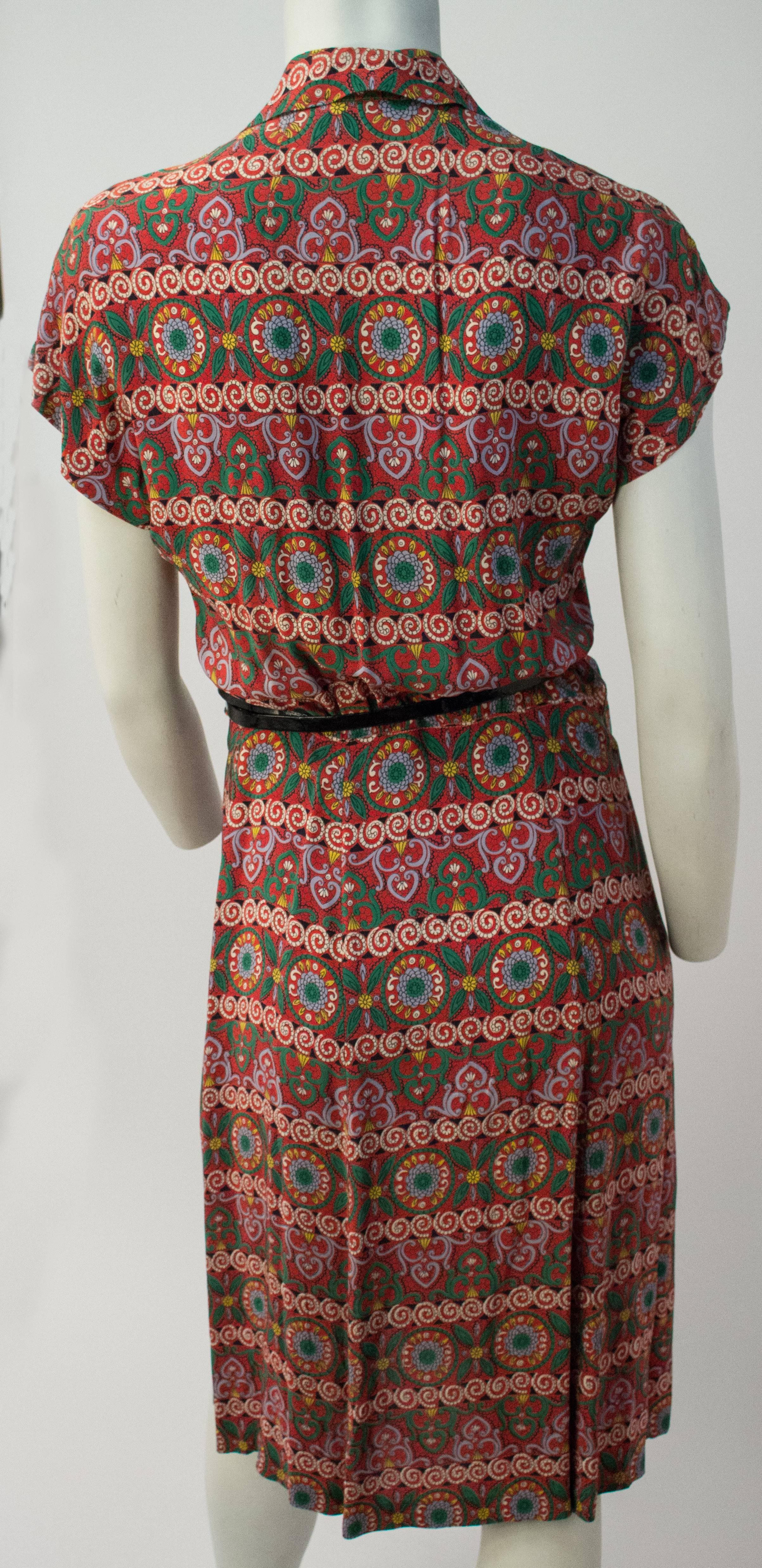 40s Printed Rayon Pleated Dress. Button front closure. Belt included, not original. 