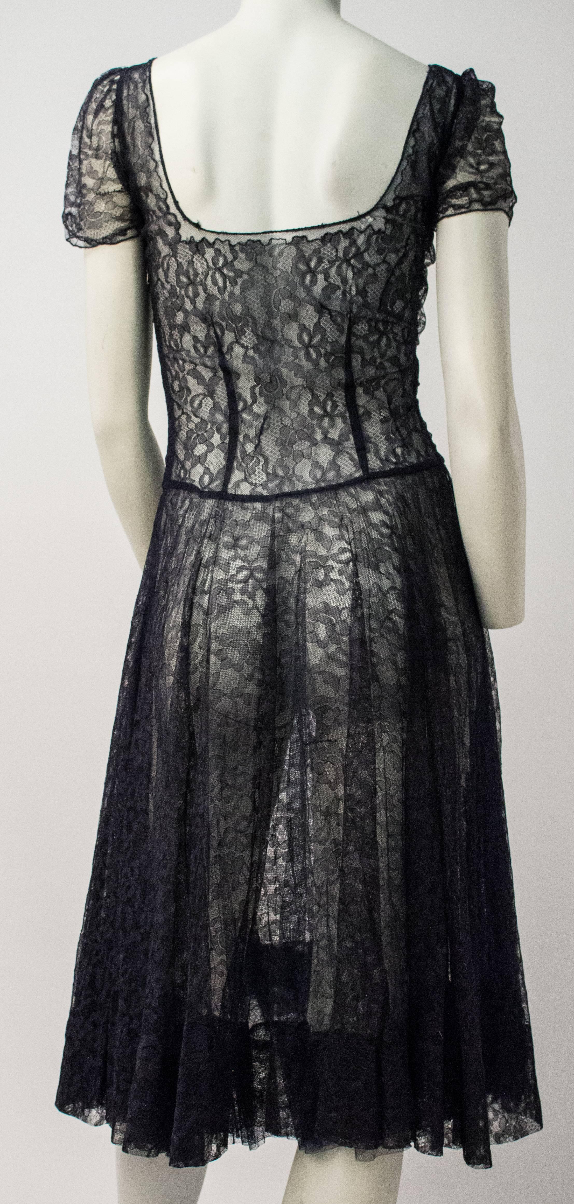 50s Navy Blue Lace Dress. Sheer lace overdress with ruched front bodice. Original belt included. Size Small (please see measurements below). 