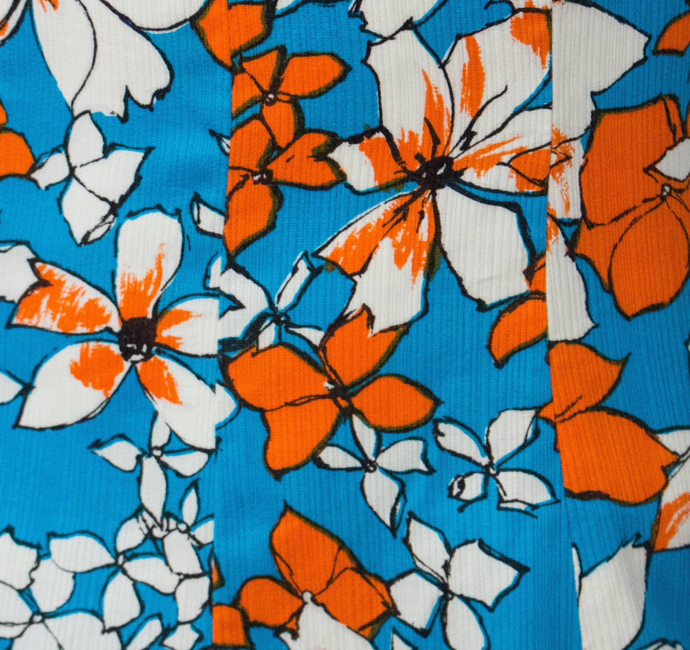 60s Floral Summer Dress. Orange and blue tropical floral print with white contrast collar. 