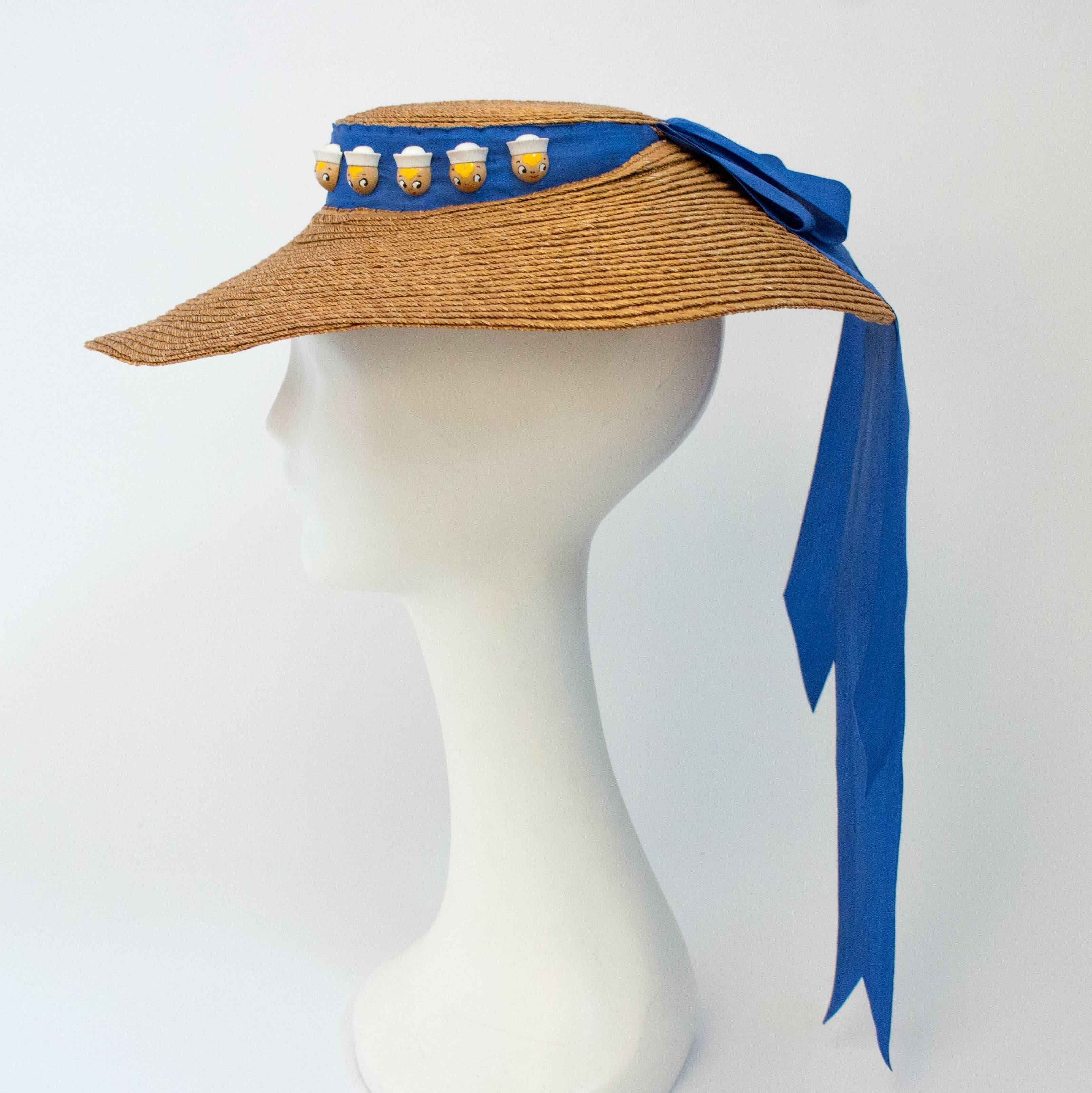 30s Wide Brim Hat w/ Wooden Sailor Button Detail. Pleated moire ribbon embellished with adorable wooden sailors.