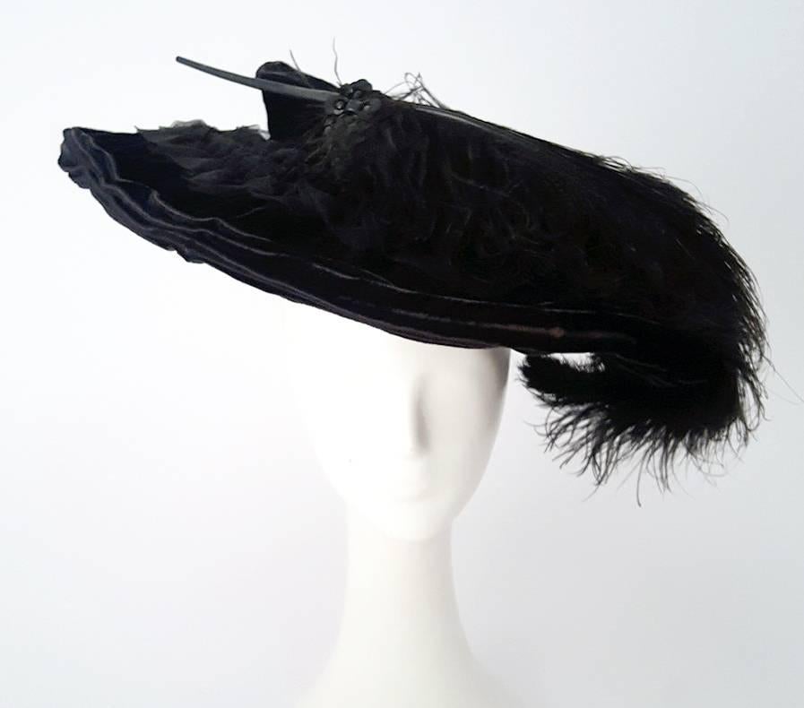 1910s Black Velvet Edwardian Hat with Ostrich Plume. Authentic Edwardian black velvet picture hat, trimmed in chiffon, beads, and an ostrich plume. Comes with velvet-ended hat pin.