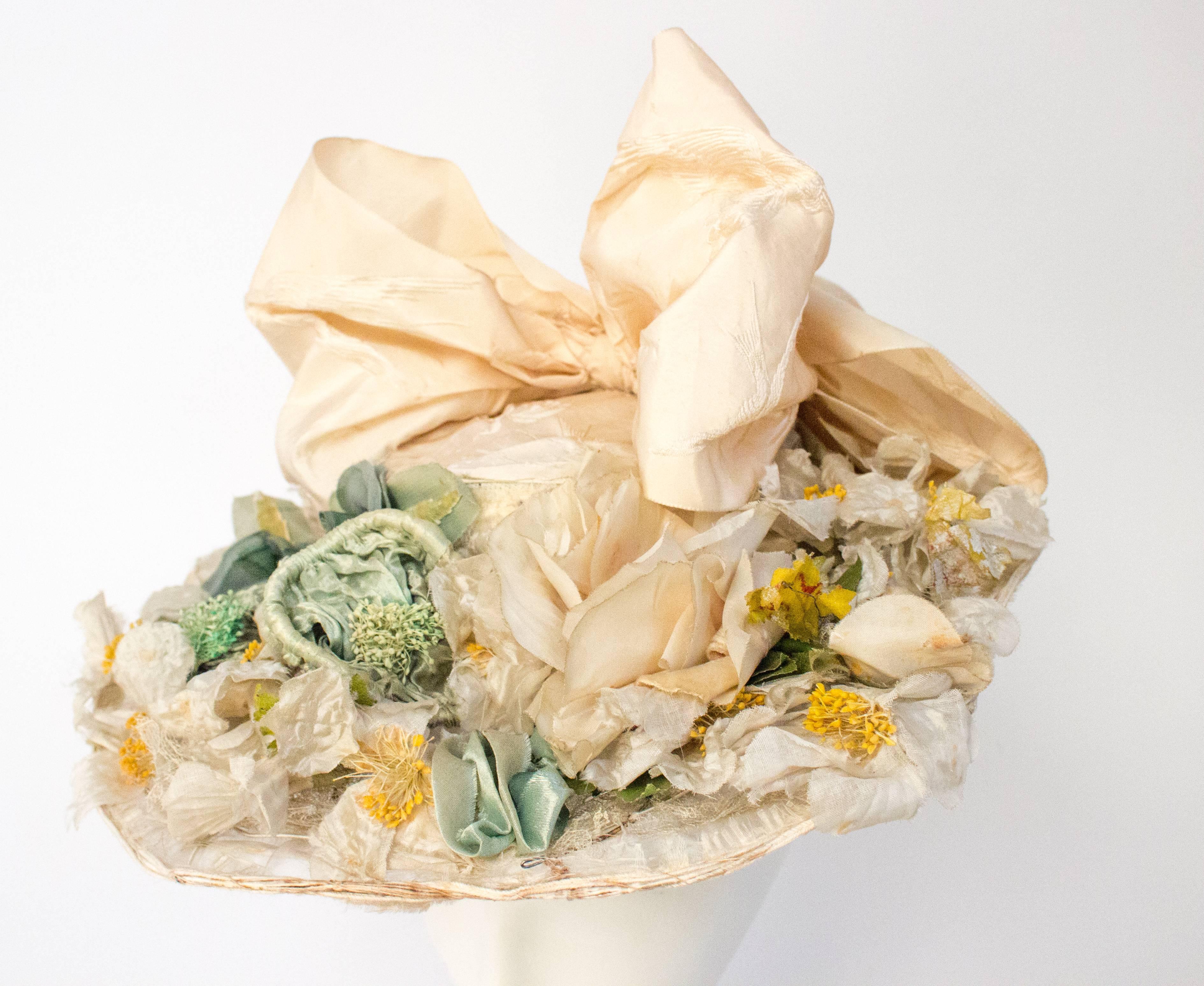 1910s Floral Edwardian Hat w/ Large Bow. Genuine white Edwardian hat w/ silk flowers and white jacquard bow with bird motif. 