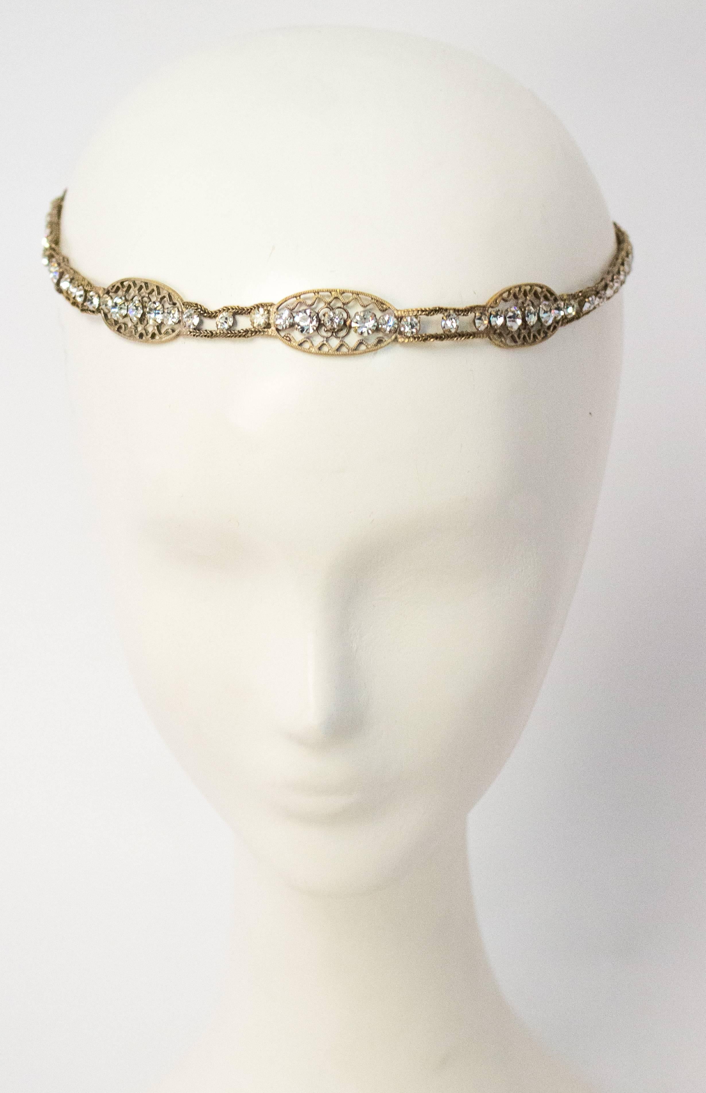 20s Crystal and Brass Filigree Headband. Braided ribbon allows for an adjustable fit.