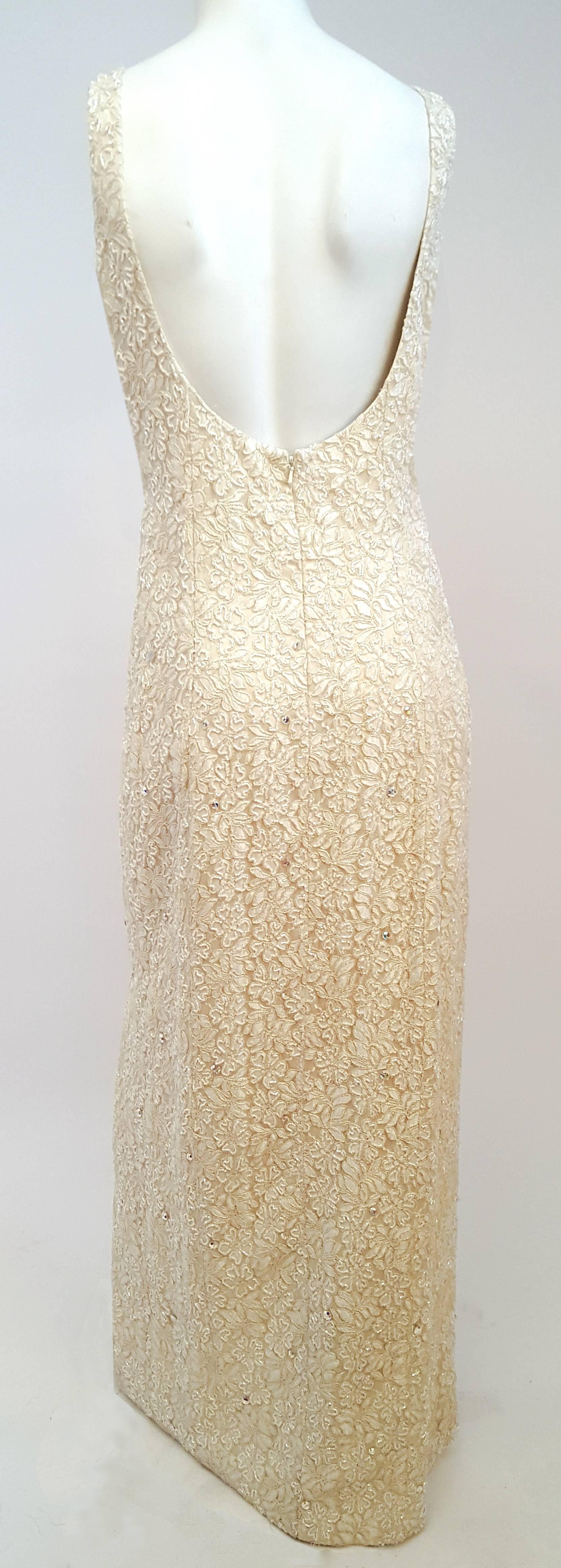 1990s Ivory Beaded Bolero and Evening Dress Set. Lace dress is fully embellished with beading and aurora borealis rhinestones. One leg side slit. Back zipper closure.