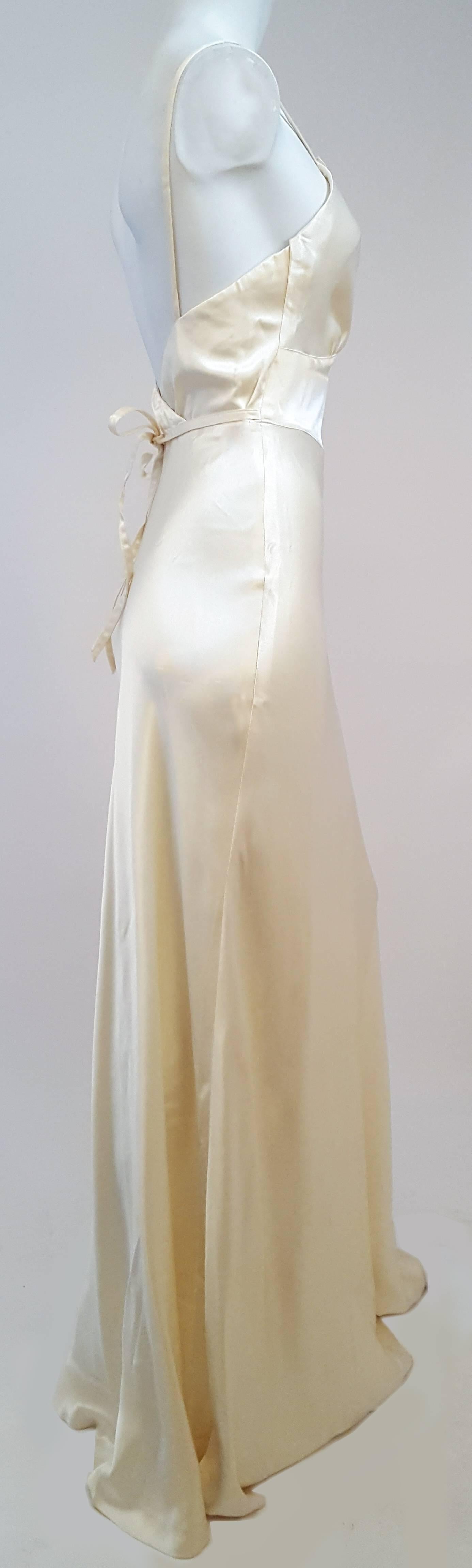 1970s Linda Carter for Young Edwardian 30s Style Ivory Dress. Linda Carter from the 1970s Wonder Woman television show for iconic 1970s brand Young Edwardian ivory gown with lace front panel. Size zip closure, waist ties in back. Deadstock with tags.