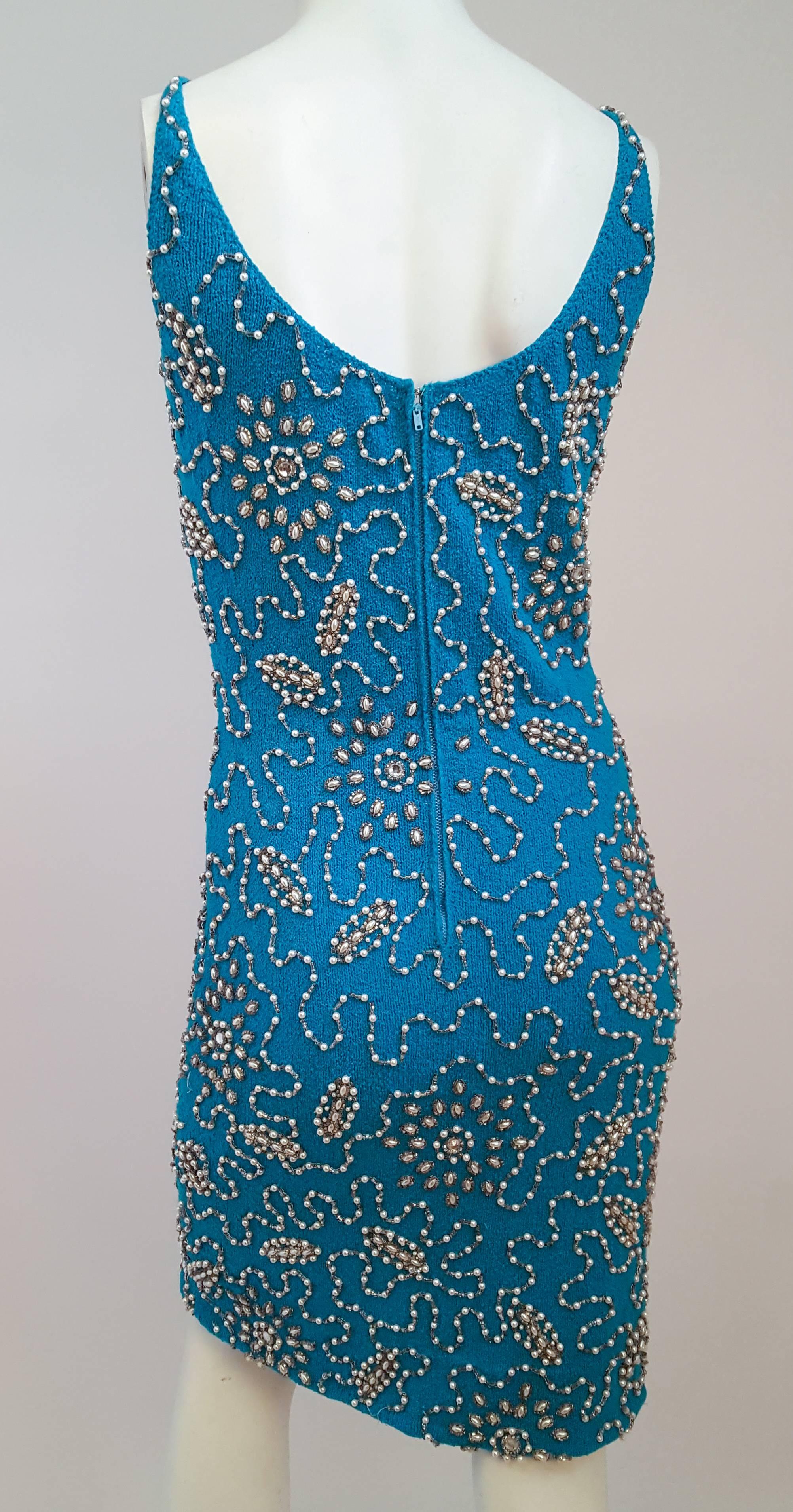 1960s Aqua Knit Beaded Mini Dress. Back zip closure. 