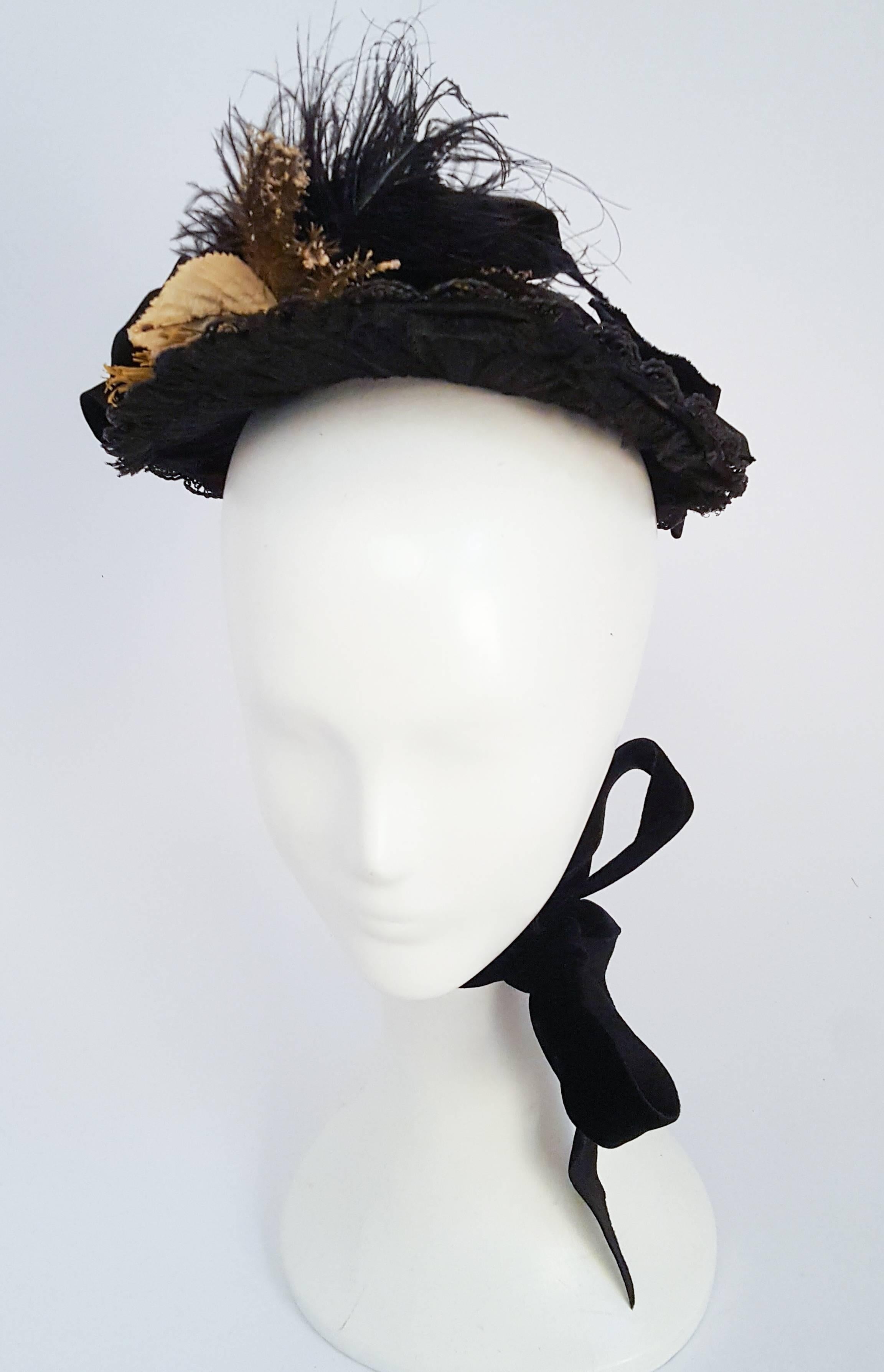 Black Victorian Bonnet w/ Beads & Feathers. Lace underside of brim. Velvet bows and jet beads on back. Feathers and flowers on brim. Silk ribbon ties.