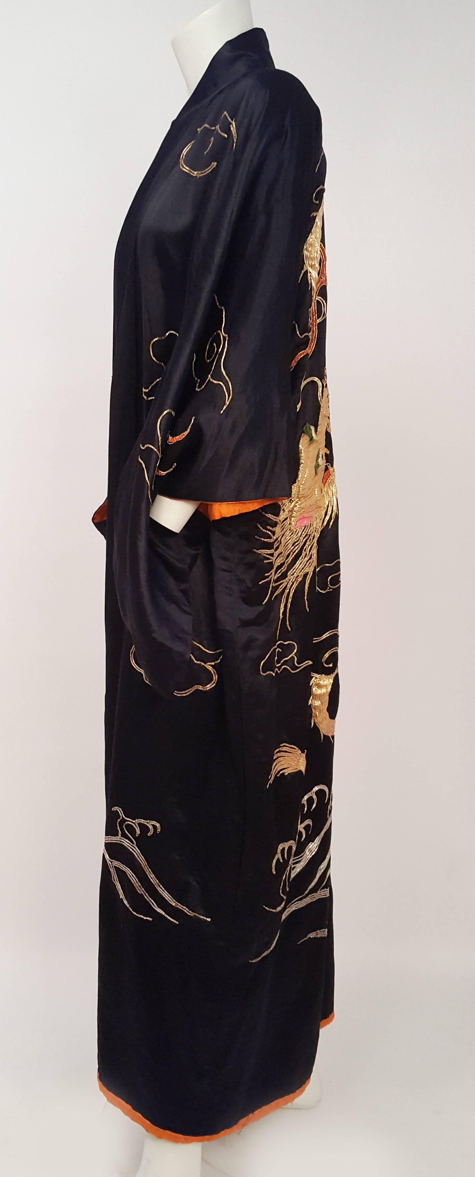 Japanese Kimono w/ Golden Dragon Embroidery. Beautiful bright orange lining. Three dimensional raised stuffed metallic dragon embroidery on back, with cloud motifs. 