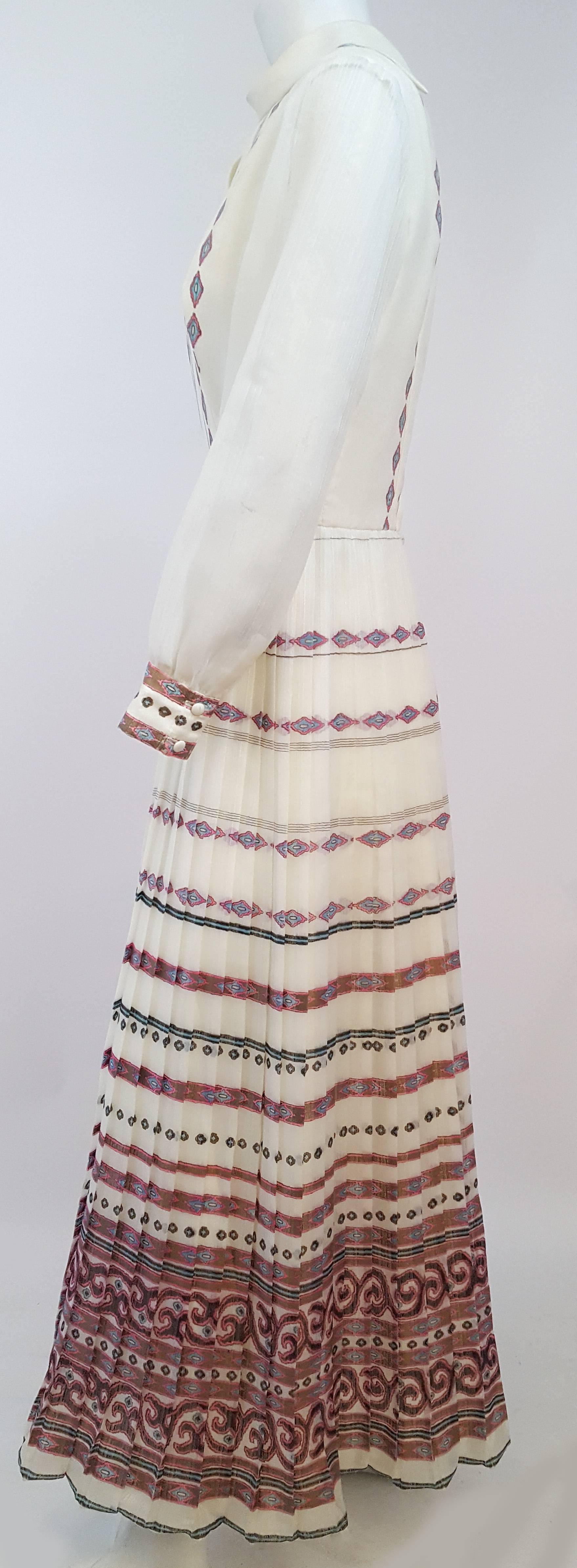 70s Shaheen Print White Maxi Dress. Interesting keyhole neckline. Sheer sleeves. Back zip closure.
