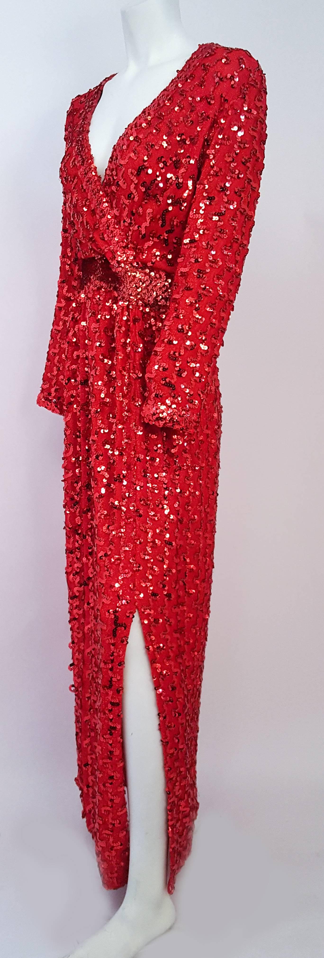 70s Lilli Diamond Red Sequin Dress. All-over red sequins on stretch jersey with red lamé threads. Faux sequin belt detail. Back zip closure. One side slit.