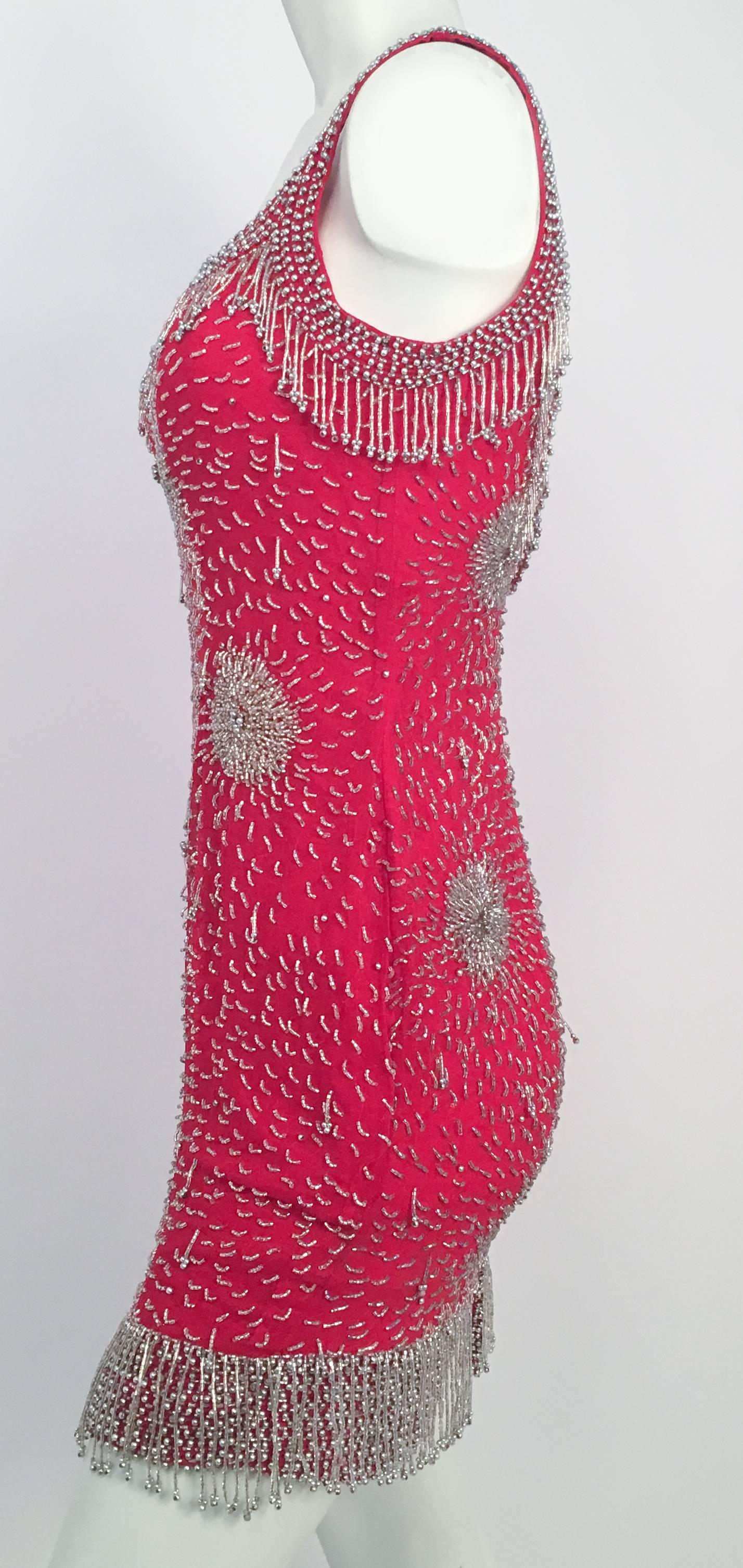 80s Beaded Red Mini Dress. Beaded fringe detail on neckline and hemline. Starburst designs beaded on chiffon w/ red silt satin lining. 