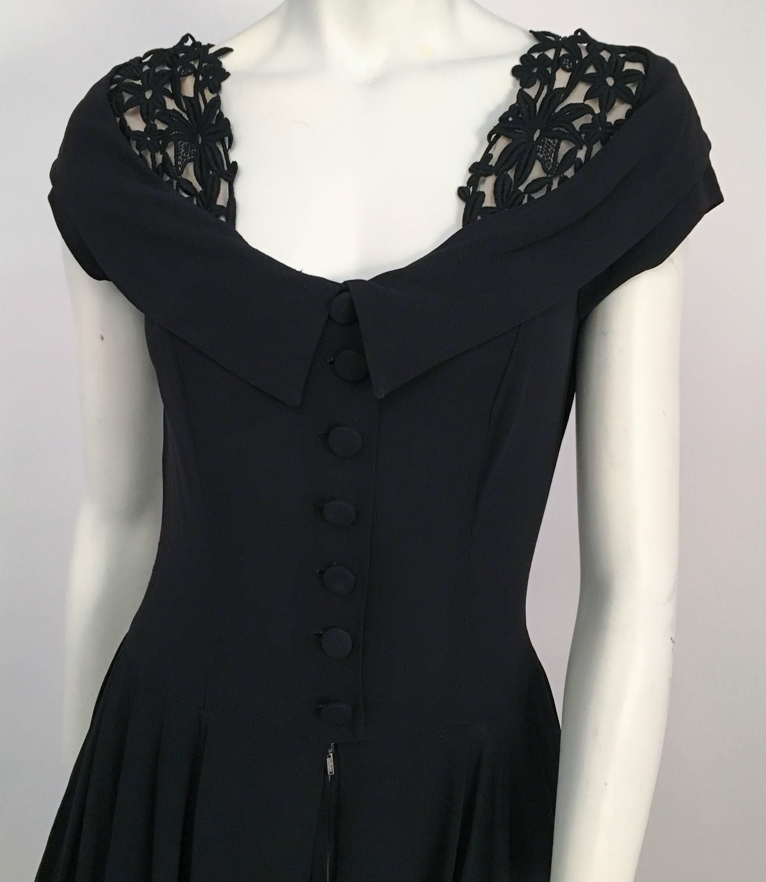 40s Black Crepe A-Line Dress w/ Lace Collar Detail. Front button and metal zipper closure. Lace neckline detail over nude mesh. Dress in photo worn over petticoat for additional support. 