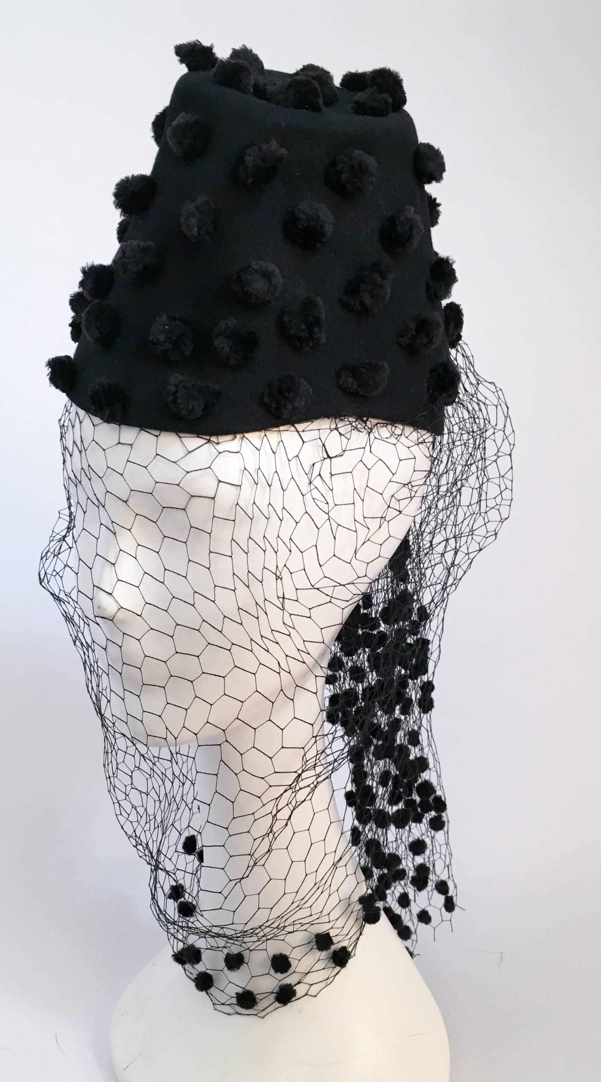 30s Black Pom Pom Hat w/ Veil. Whimsical black pom pom adorn entire body of hat and back of veil. Veil drapes over entire face. 