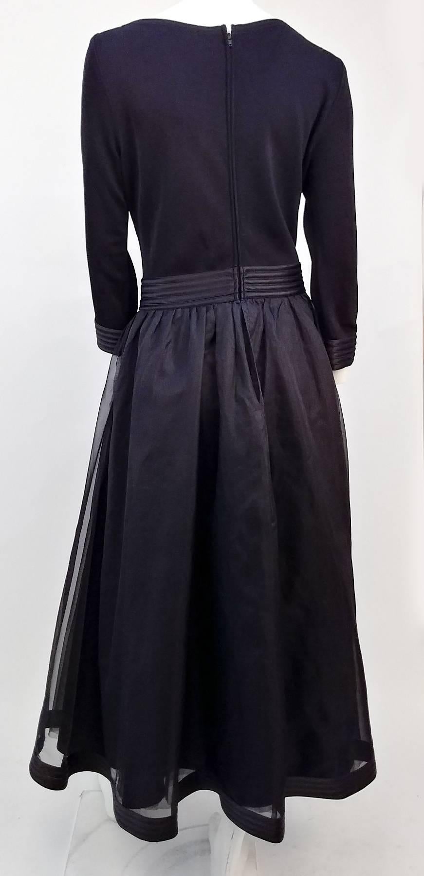 80s Tadashi Organza and Jersey Gown. Thick jersey knit bodice. Unlined. Skirt has an outer layer of organza, supported by two layers of mesh and lining. Zips up back.