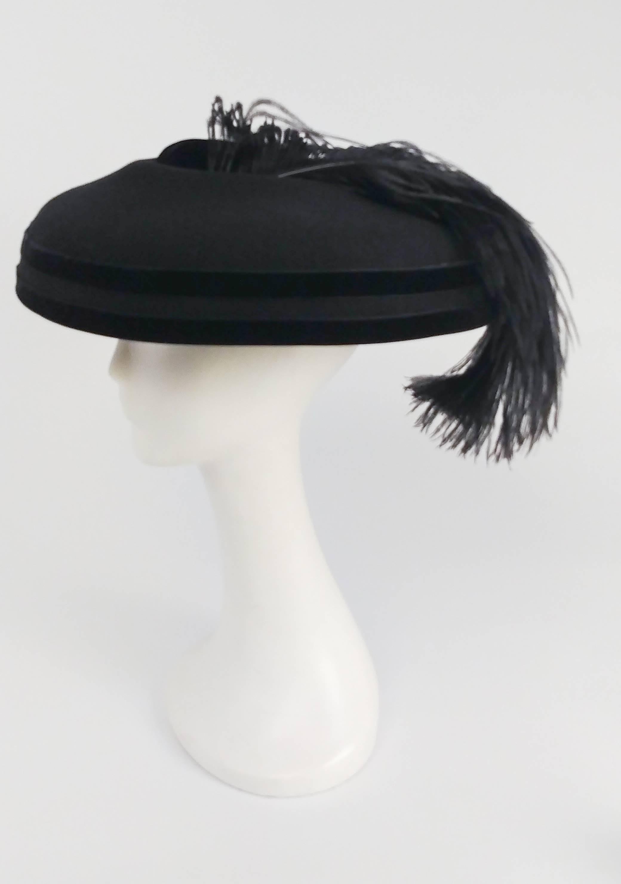 1980s Black Wool Wide Brimmed Hat w/ Feather. Two bands of velvet trim. 