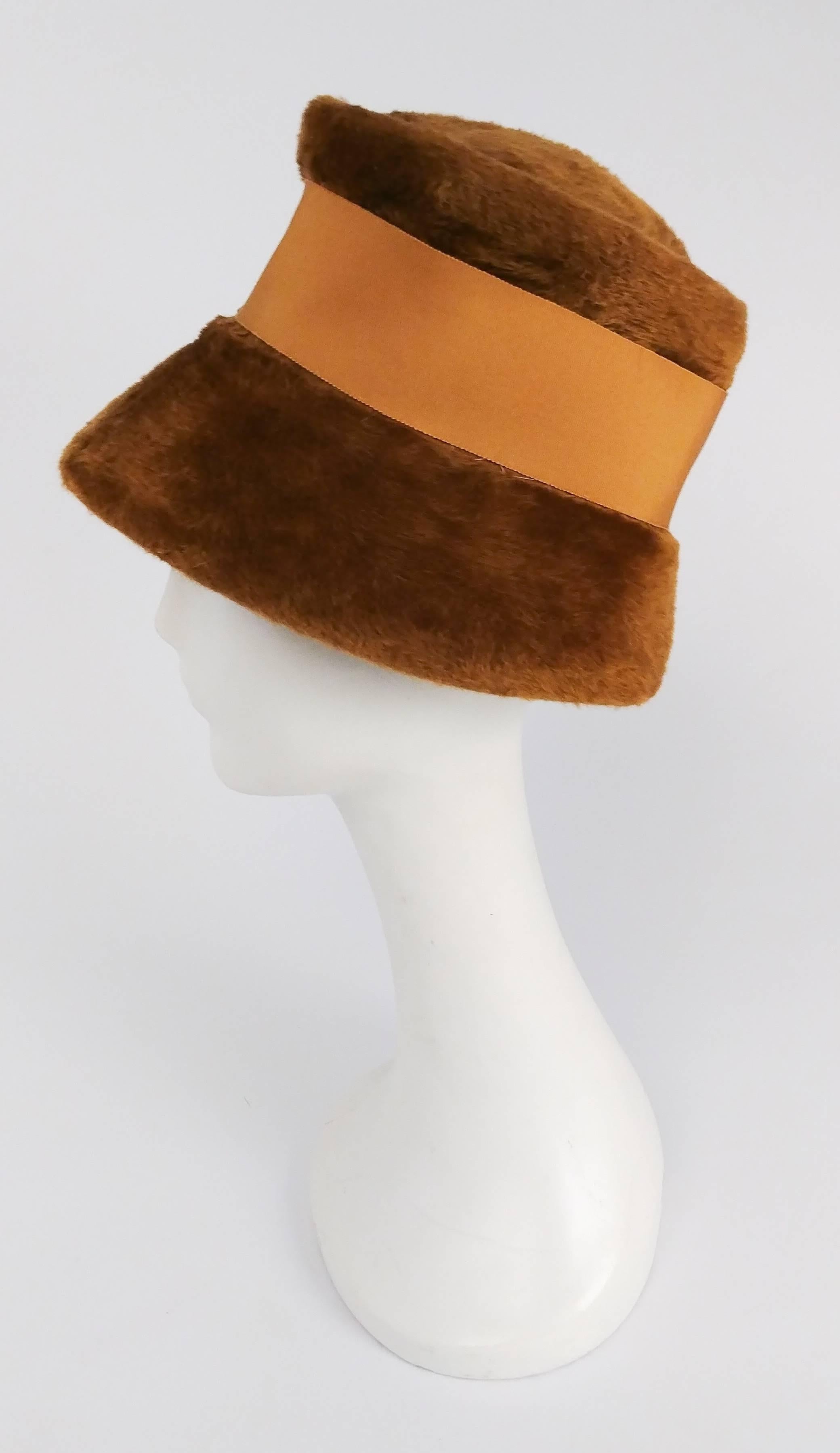 1960s Ochre Yellow Mod Hat w/ Grosgrain Ribbon. Cloche style hat sits low over the eyes, decorated with a wide ribbon. 