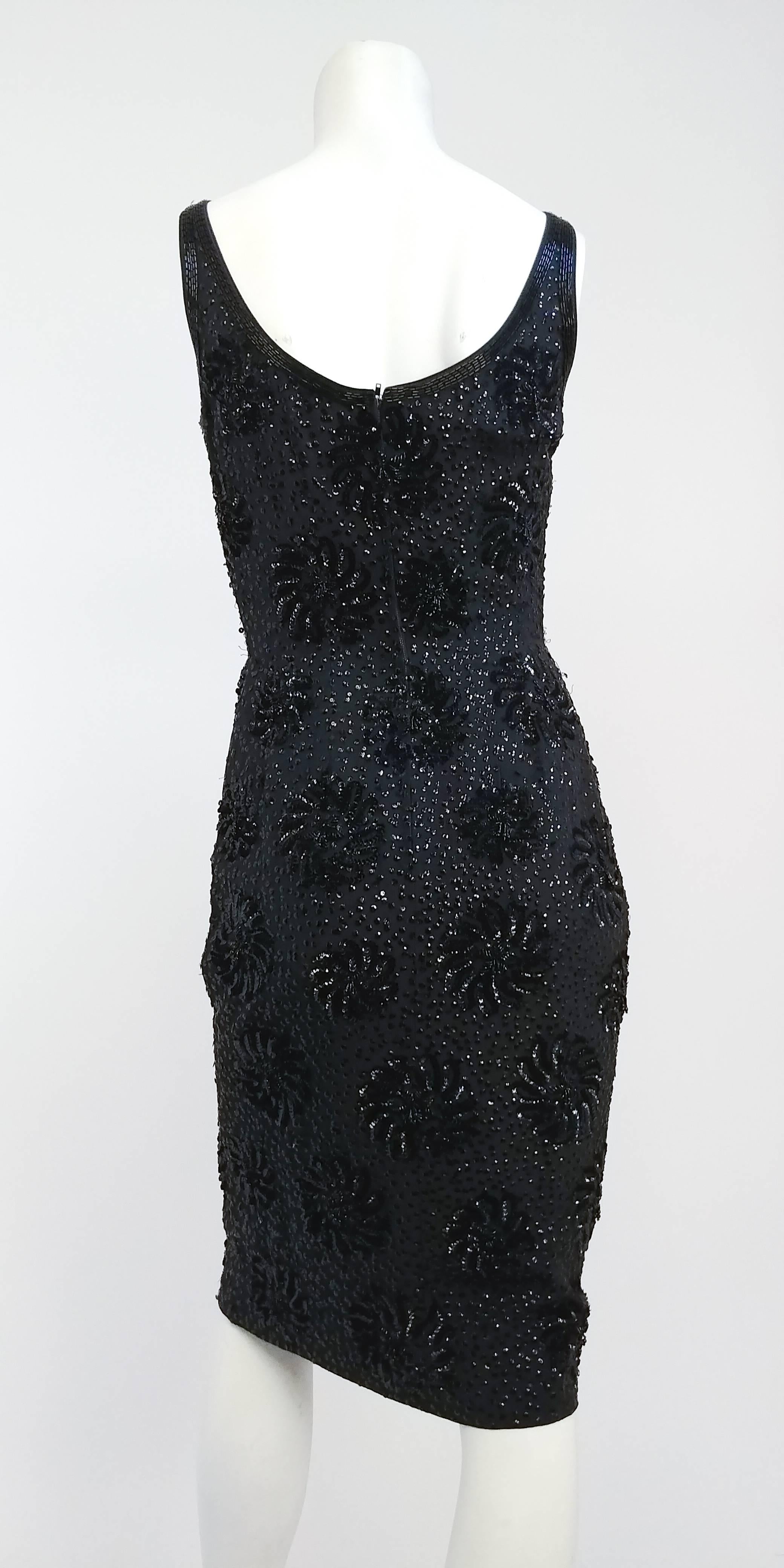 1960s Sequin Cocktail Sheath Dress. Sequins for all-over flower pattern. Fully lined. Beaded neckline detail.