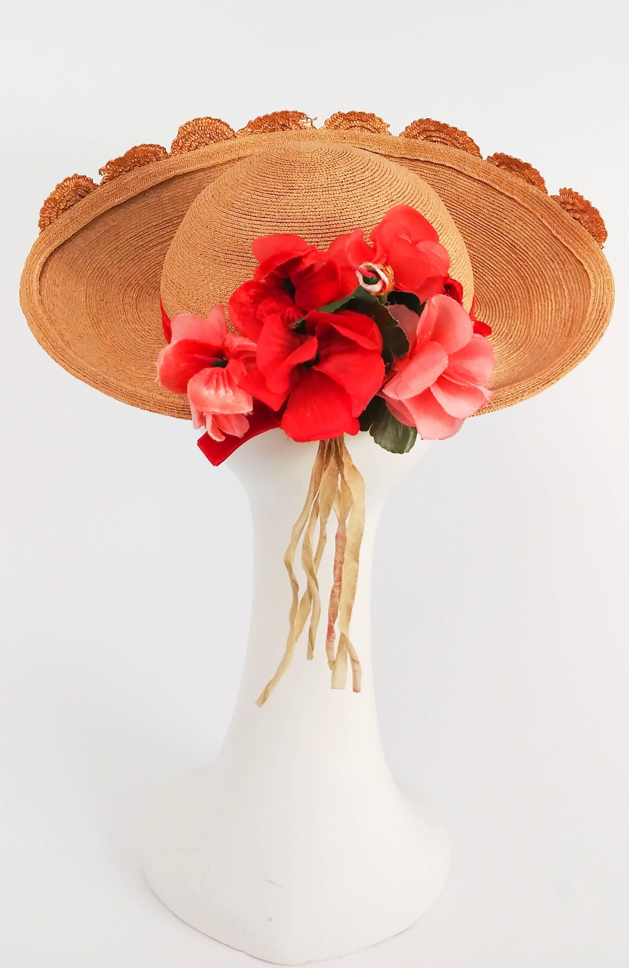 straw hat with red ribbon