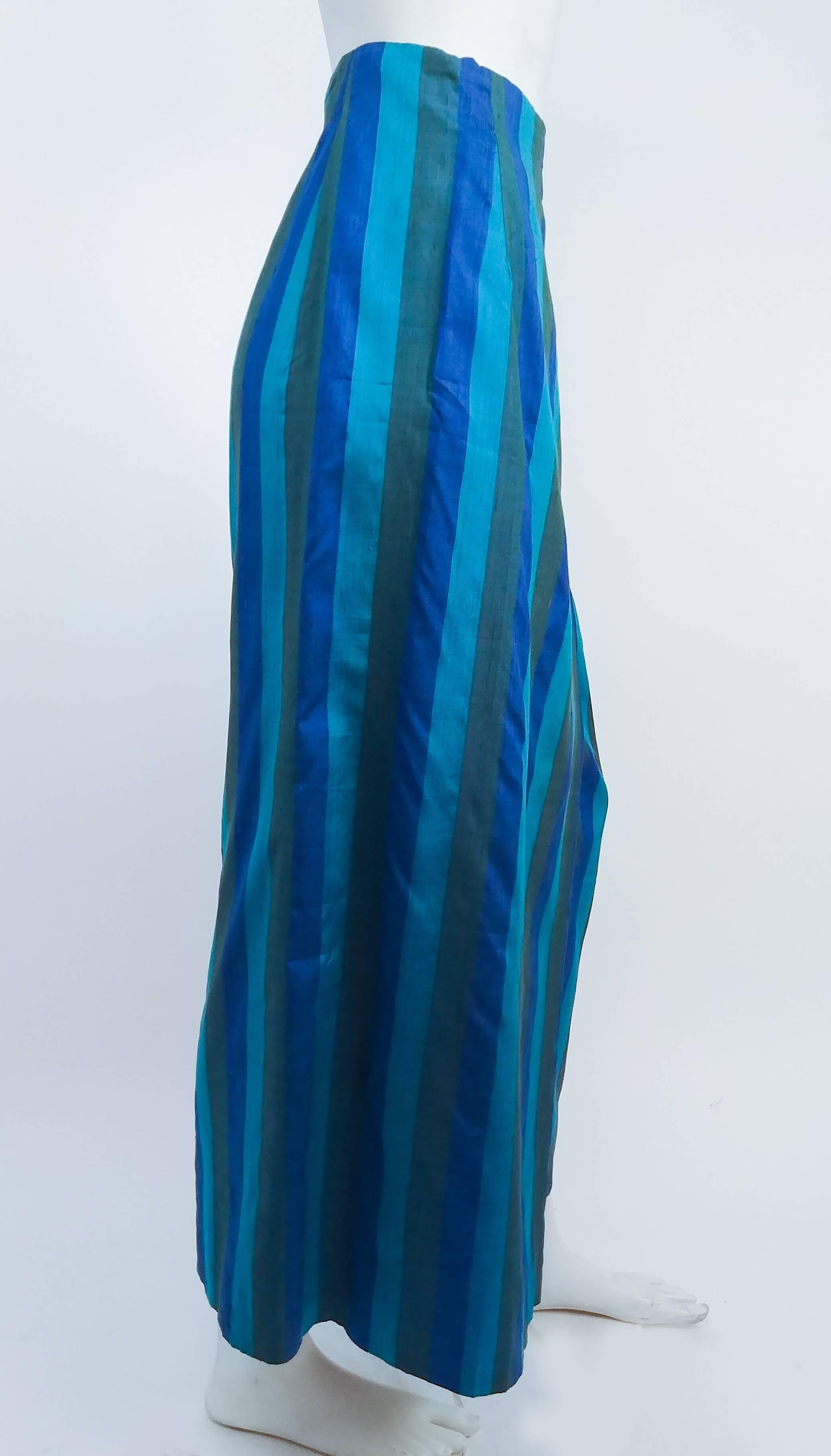 1960s Striped Shantung Wrap Skirt. Blue and green vertical stripes. Lined in cotton. Darted all along waist to give definition to hips. Fastens with hooks and eyes. 